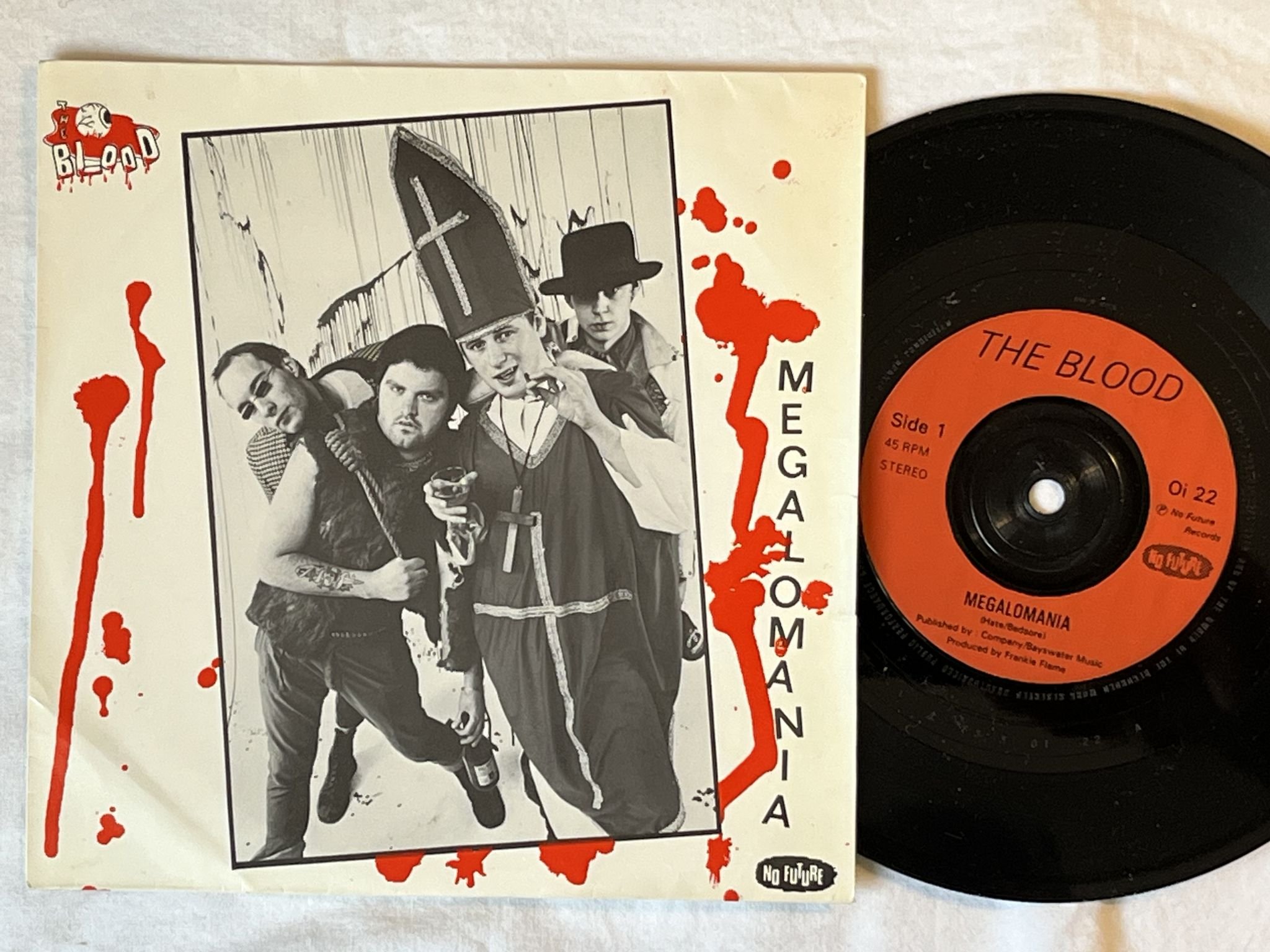 Omslagsbild för skivan THE BLOOD Megalomania 7" -83 UK no future records Oi 22