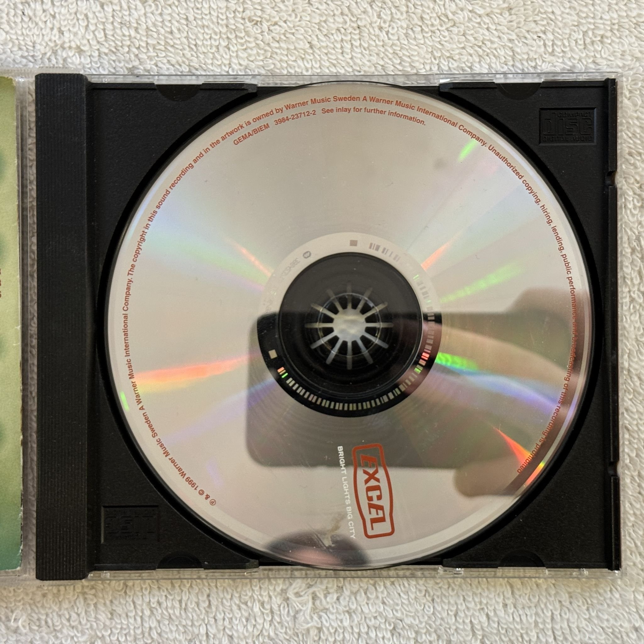 Omslagsbild för skivan EXCEL Bright Lights Big City CD -99 WARNER 3984-23712-2 SWERAP