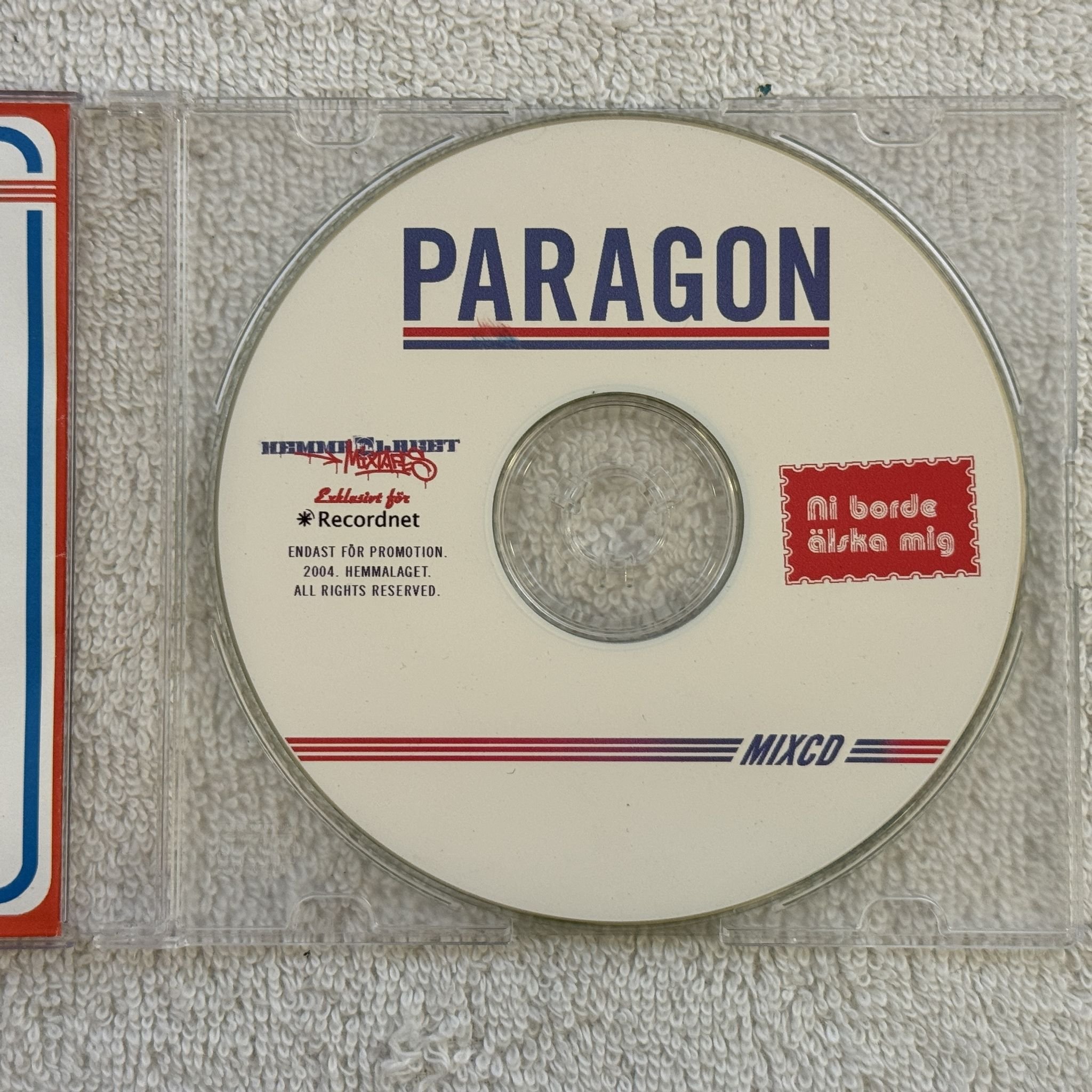 Omslagsbild för skivan PARAGON Ni Borde Älska Mig CD 2004 mixtape HEMMALAGET SWERAP