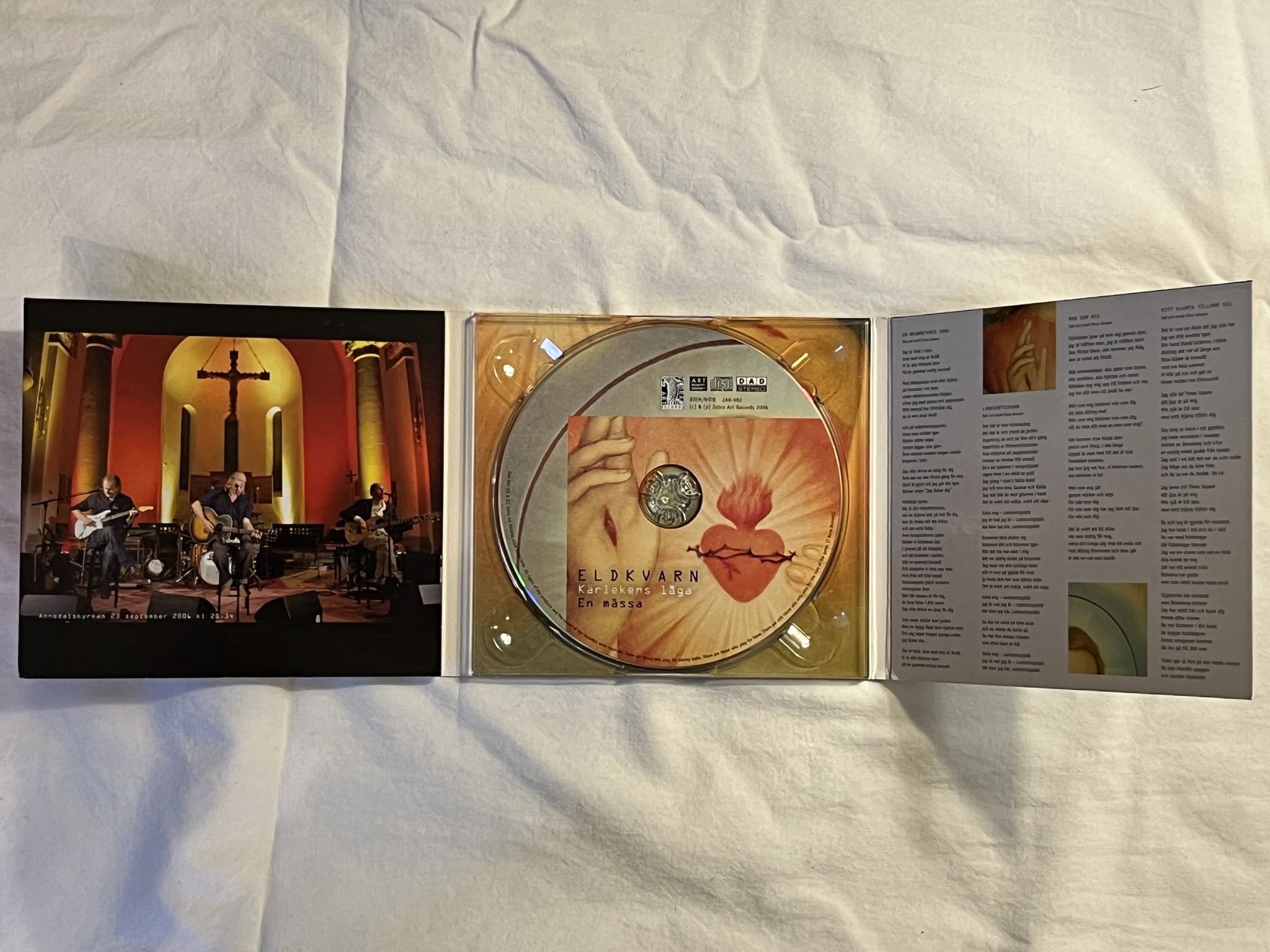 Omslagsbild för skivan ELDKVARN Kärlekens Låga - En Mässa CD Zebra Art Records ZAR-982 *** SIGNED ***