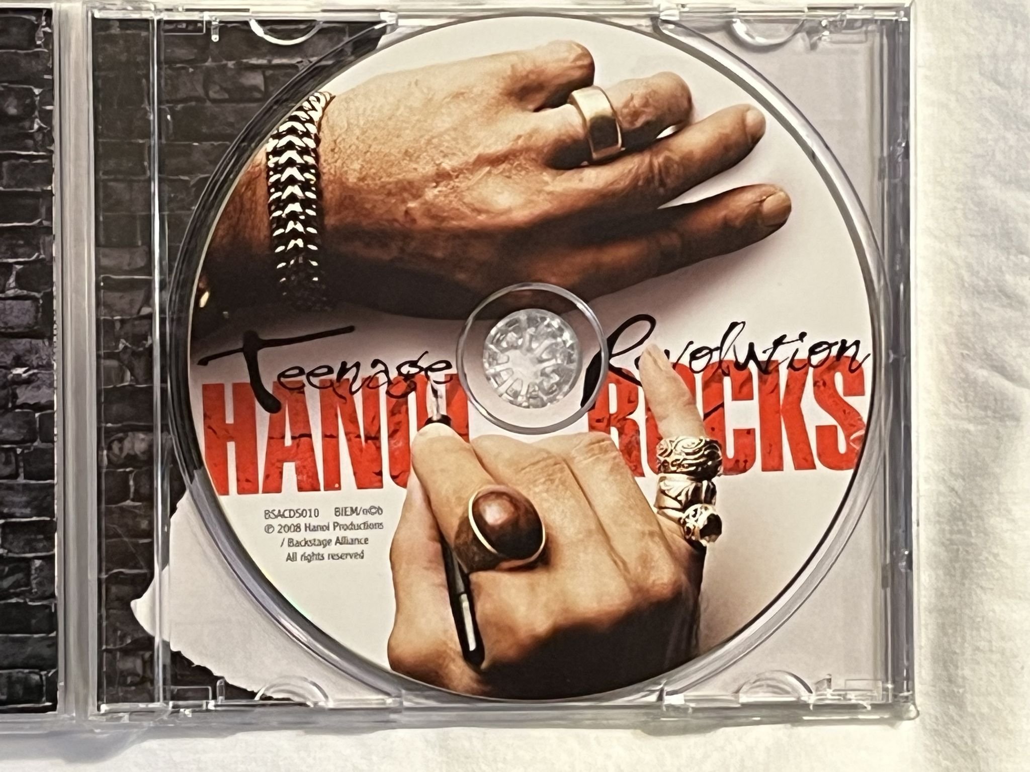 Omslagsbild för skivan HANOI ROCKS Teenage Revolution CD 2008 BACKSTAGE BSACDS010 ** SIGNED **