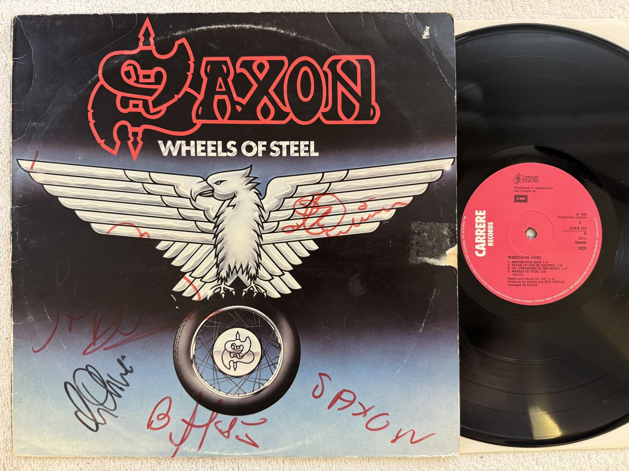 Omslagsbild för skivan SAXON Wheels Of Steel LP -80 ncb CARRERE CALS 115 *** SIGNED ***