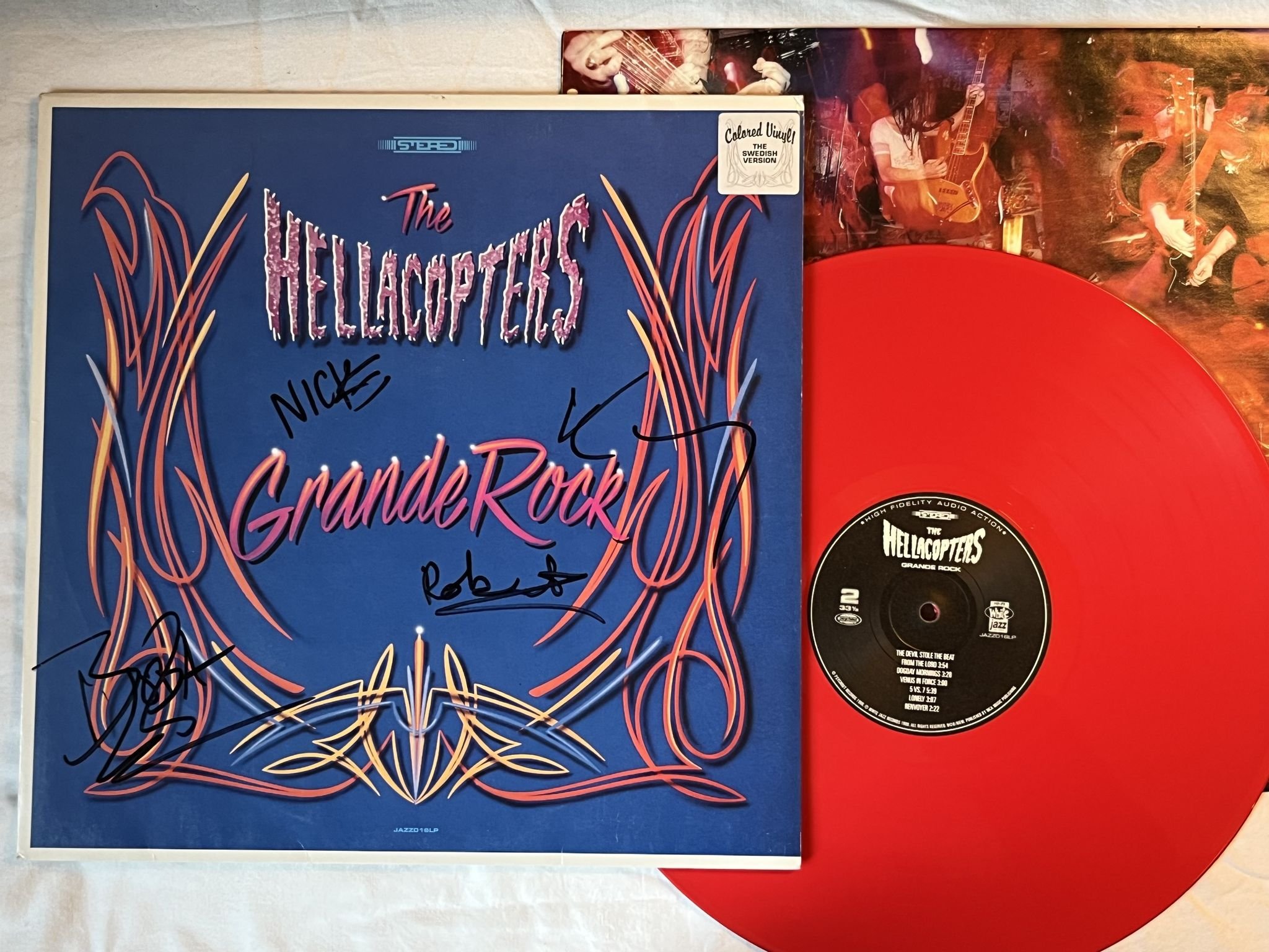 Omslagsbild för skivan THE HELLACOPTERS grande rock LP -99 JAZZ016LP red vinyl *** FULLY SIGNED ***