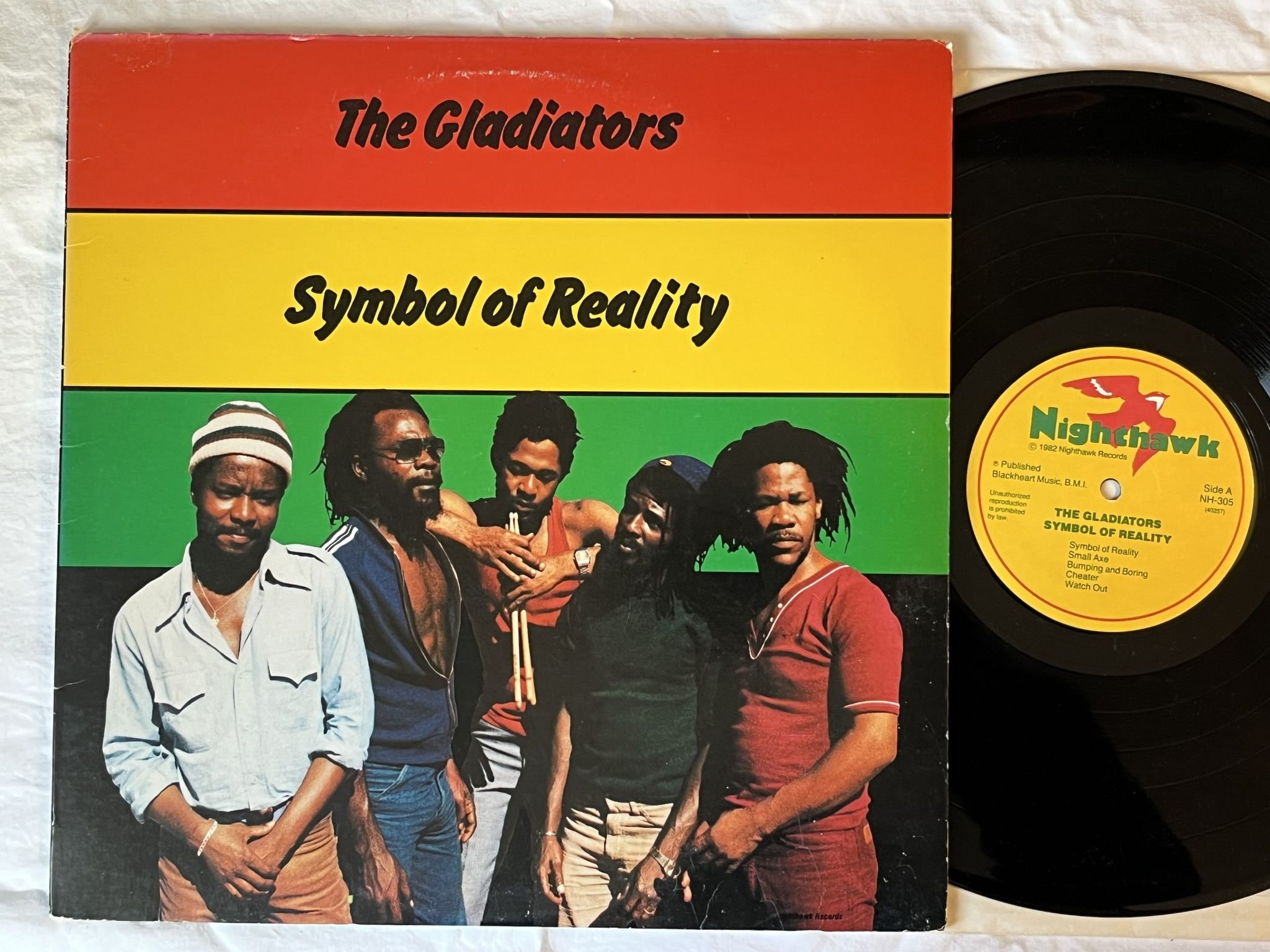 Omslagsbild för skivan THE GLADIATORS symbol of reality LP -82 US NIGHTHAWK NH-305