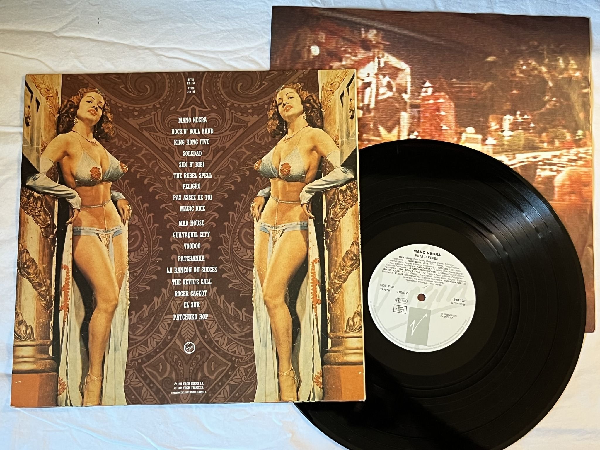 Omslagsbild för skivan MANO NEGRA puta's fever LP -89 VIRGIN 210195