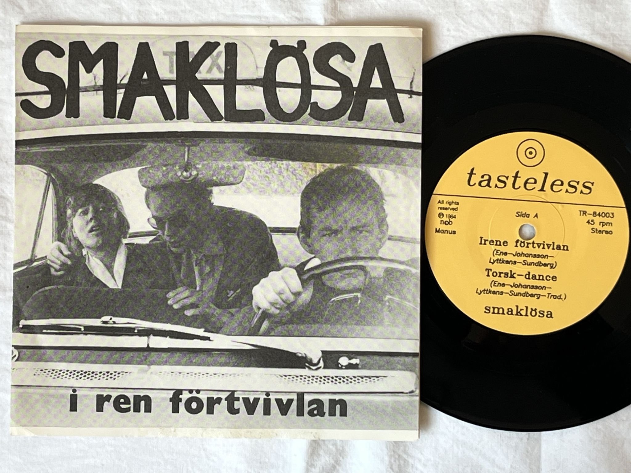 Omslagsbild för skivan SMAKLÖSA I Ren Förtvivlan 7"EP -84 TASTELESS TR-84003