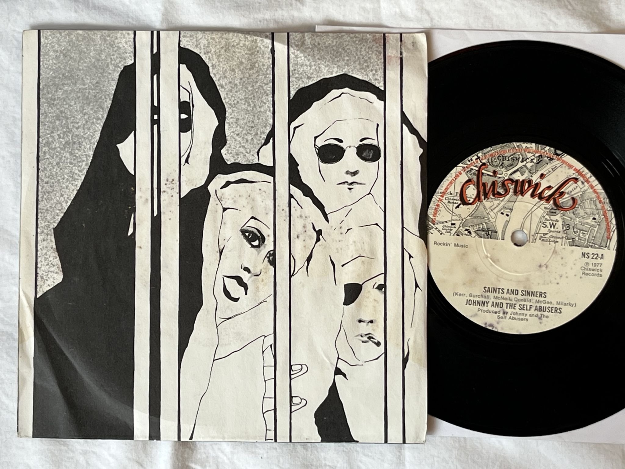 Omslagsbild för skivan Johnny And The Self Abusers – Saints And Sinners 7" -77 UK CHISWICK NS 22