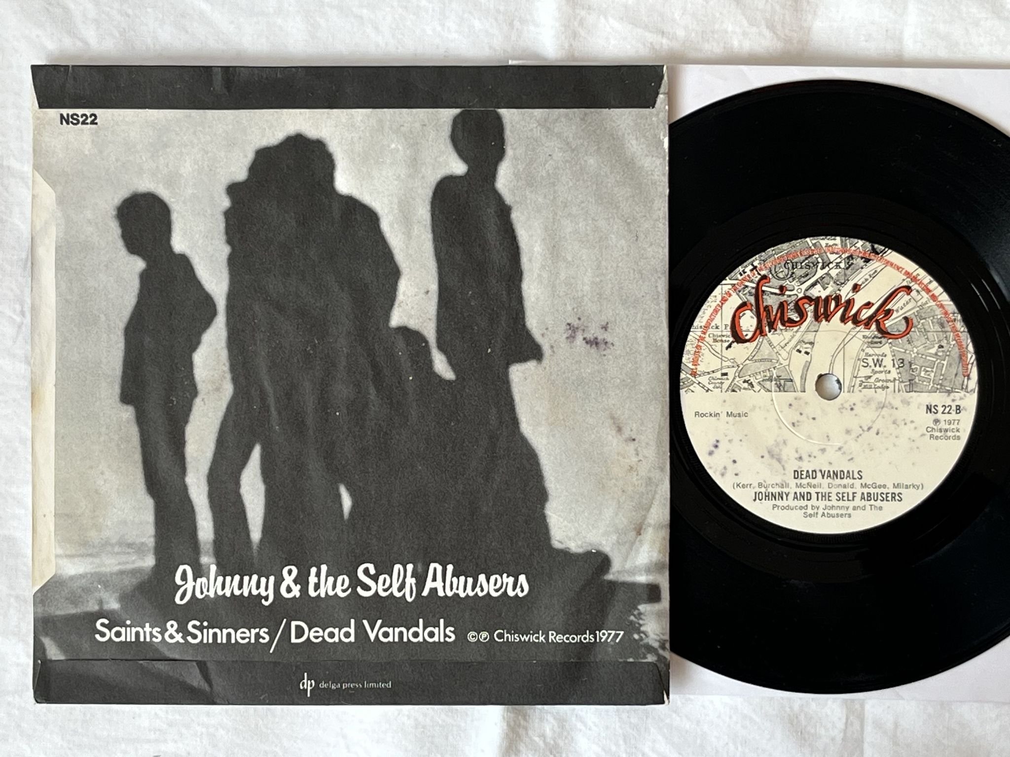 Omslagsbild för skivan Johnny And The Self Abusers – Saints And Sinners 7" -77 UK CHISWICK NS 22