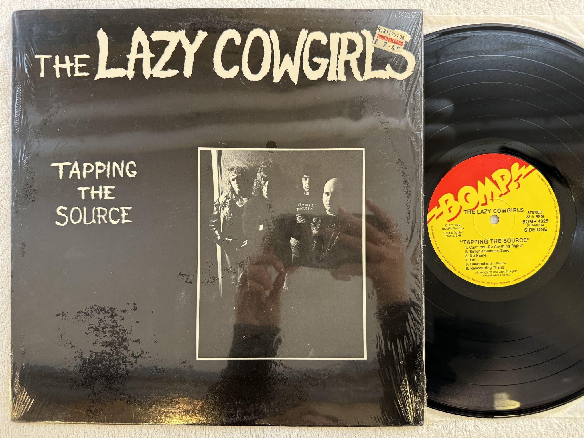 Omslagsbild för skivan THE LAZY COWGIRLS Tapping The Source LP -87 US BOMP! BOMP 4025