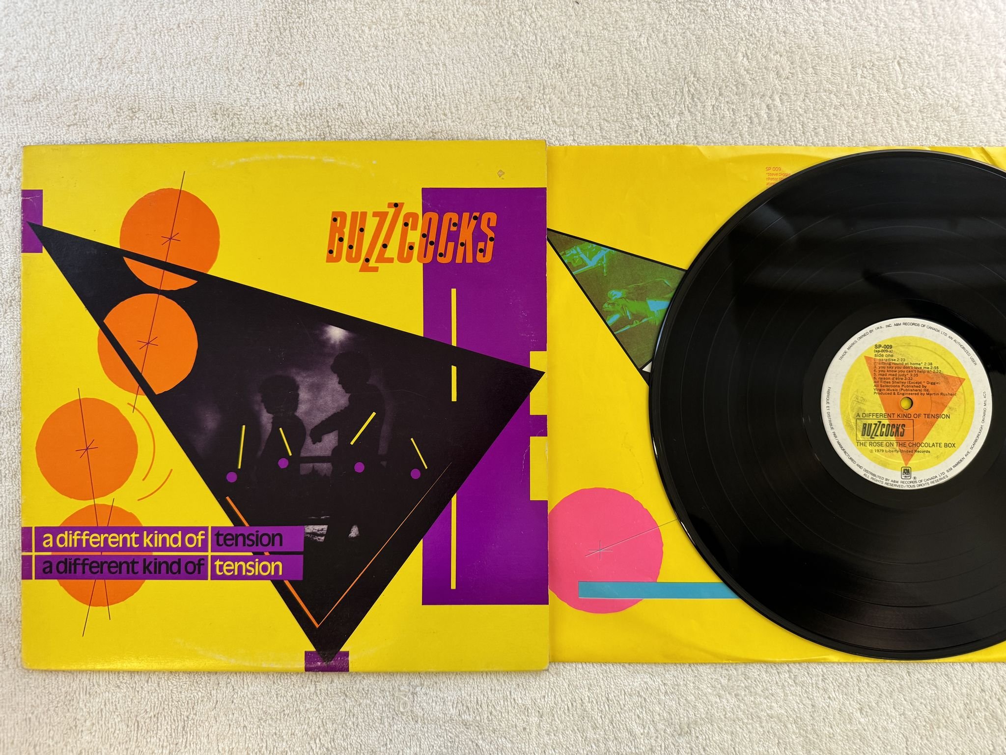 Omslagsbild för skivan BUZZCOCKS a different kind of tension LP -80 Can A&M SP-009