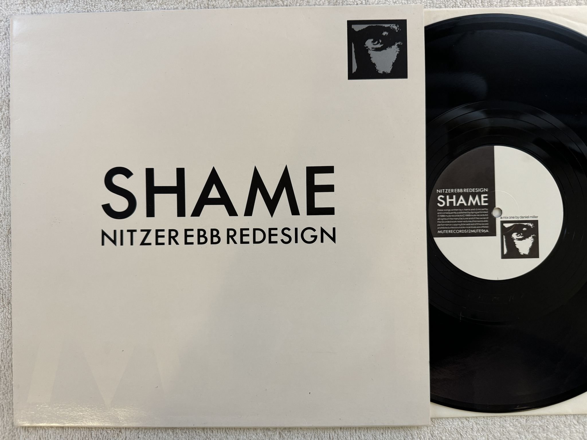 Omslagsbild för skivan NITZER EBB shame 12" -89 UK MUTE 12MUTE96