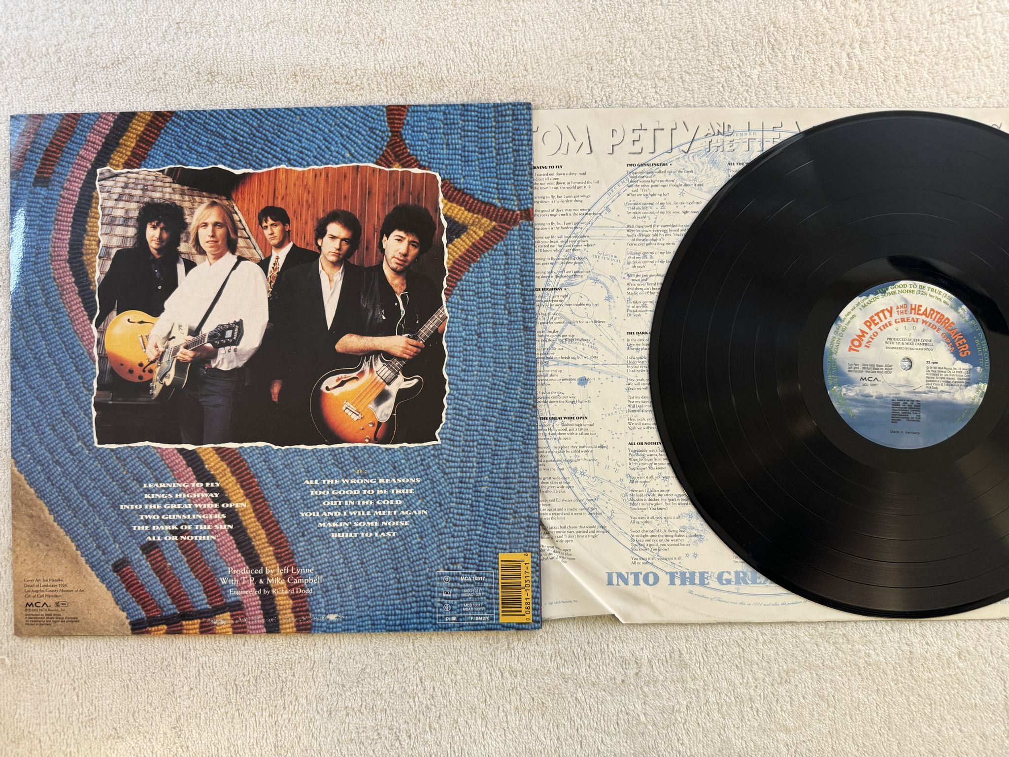 Omslagsbild för skivan TOM PETTY into the great wide open LP -89 Ger MCA 10317