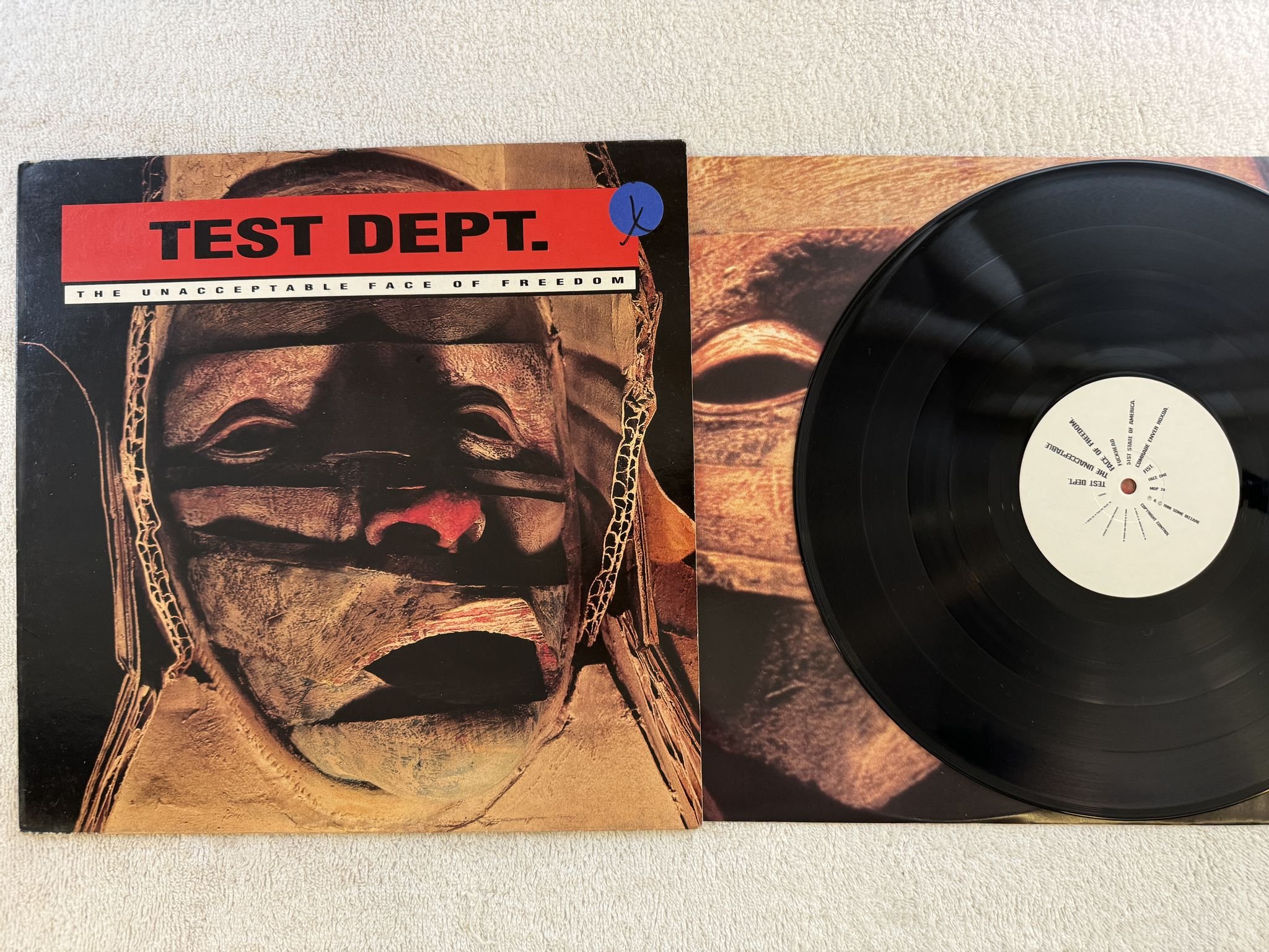 Omslagsbild för skivan TEST DEPT. The Unacceptable Face Of Freedom LP -86 re UK MINISTRY OF POWER MOP 2
