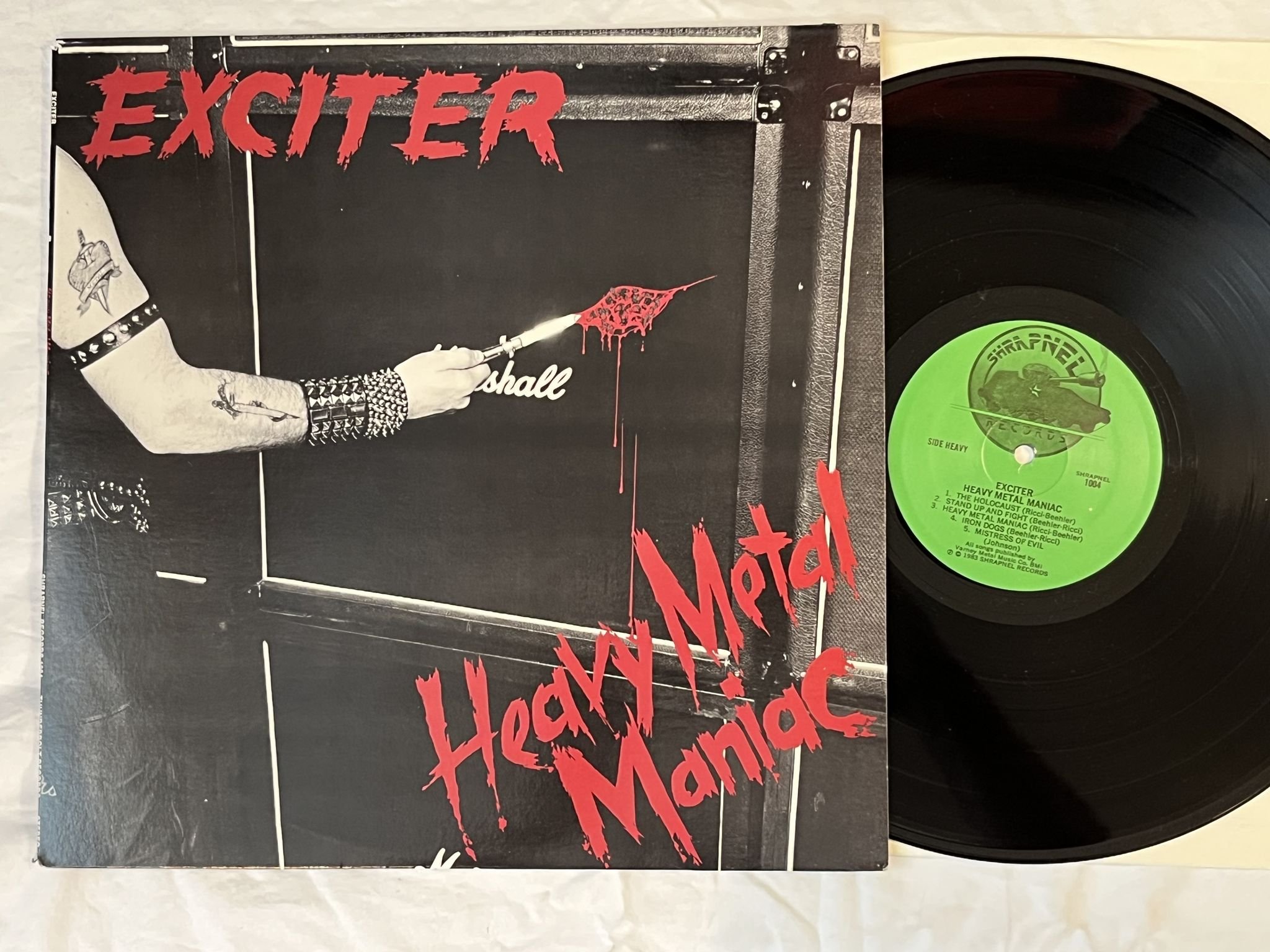 Omslagsbild för skivan EXCITER heavy metal maniac LP -83 US SHRAPNEL 1004 *** SPEED METAL ***