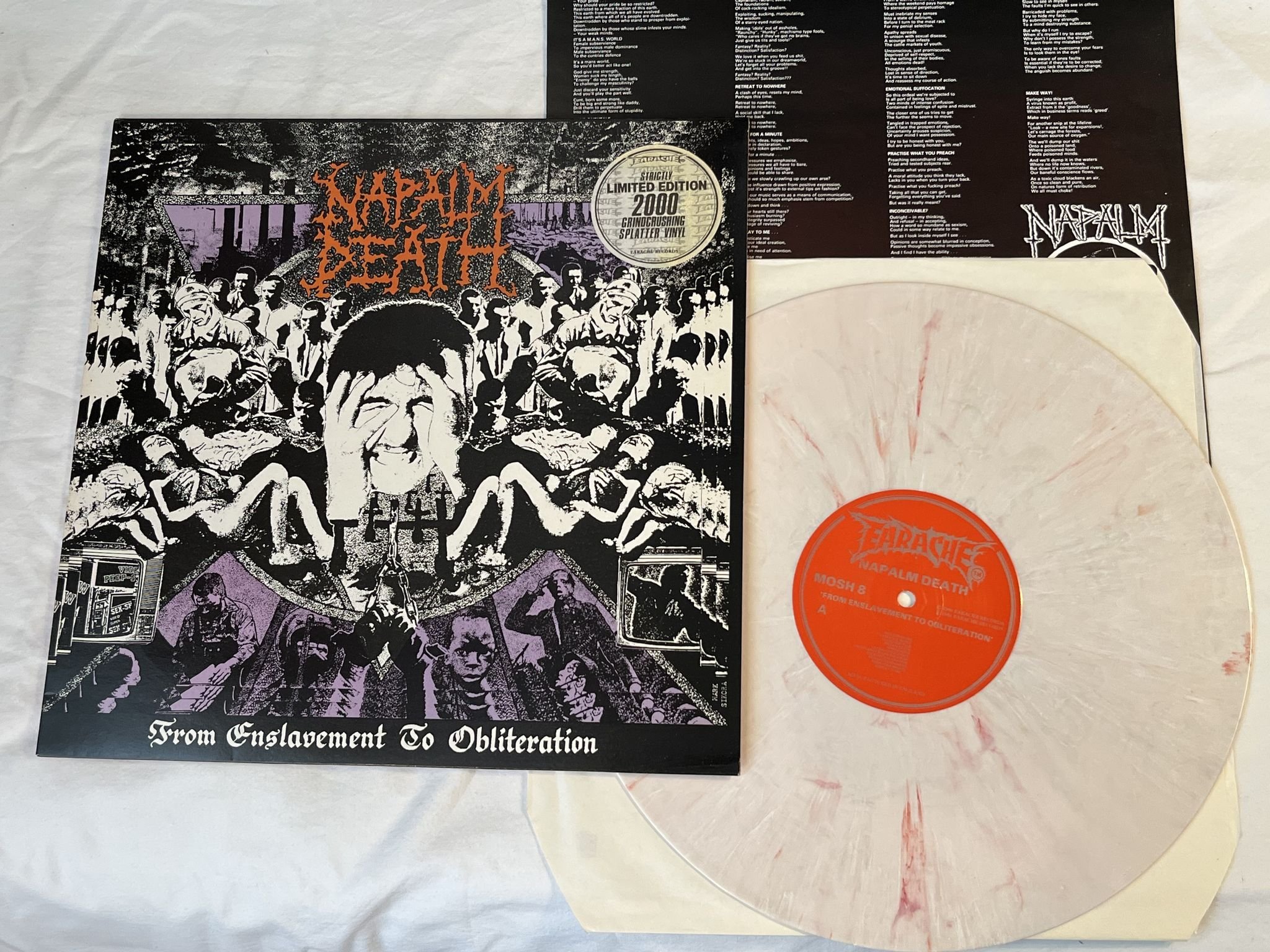 Omslagsbild för skivan NAPALM DEATH From Enslavement To Obliteration LP -91 UK EARACHE ** Splatter **