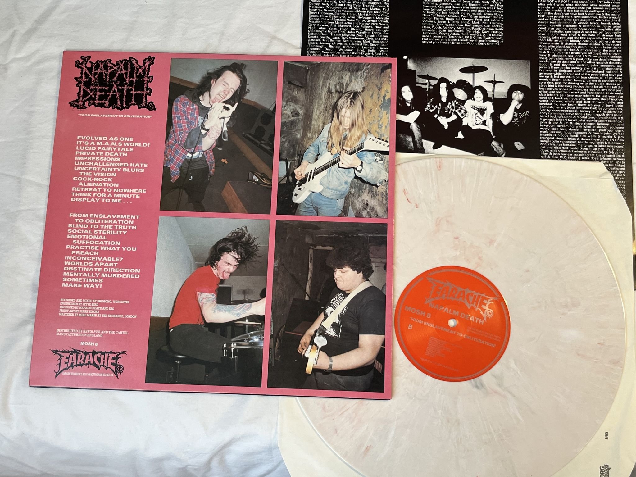 Omslagsbild för skivan NAPALM DEATH From Enslavement To Obliteration LP -91 UK EARACHE ** Splatter **