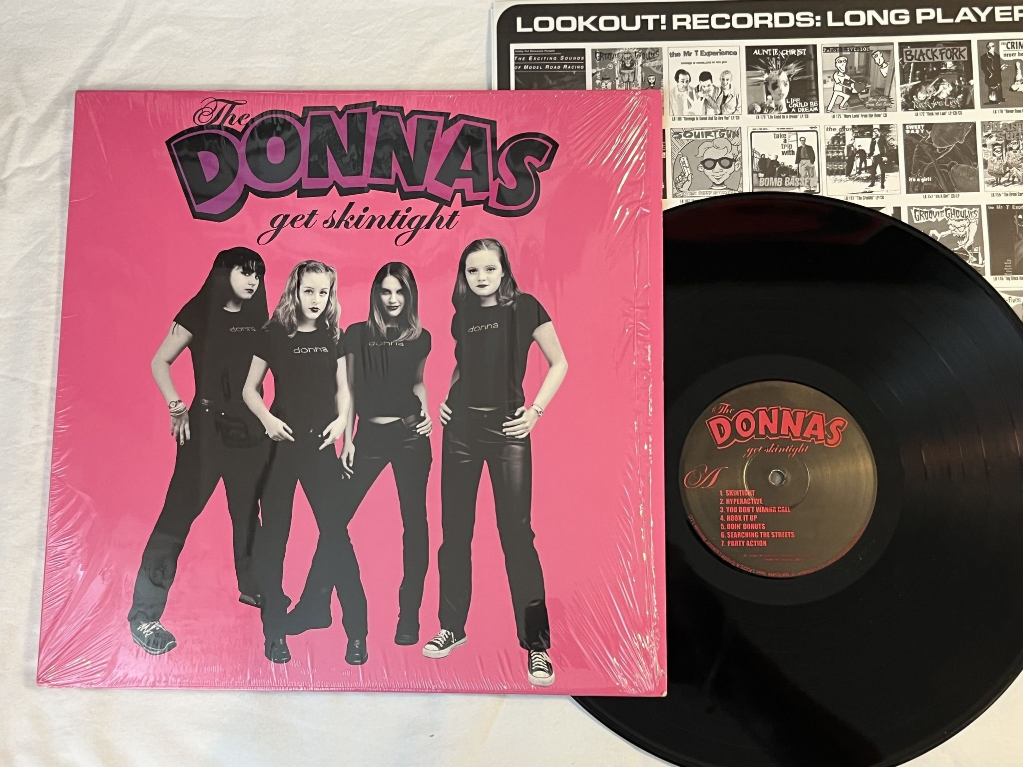 Omslagsbild för skivan THE DONNAS Get Skintight LP -99 US LOOKOUT! LK 225