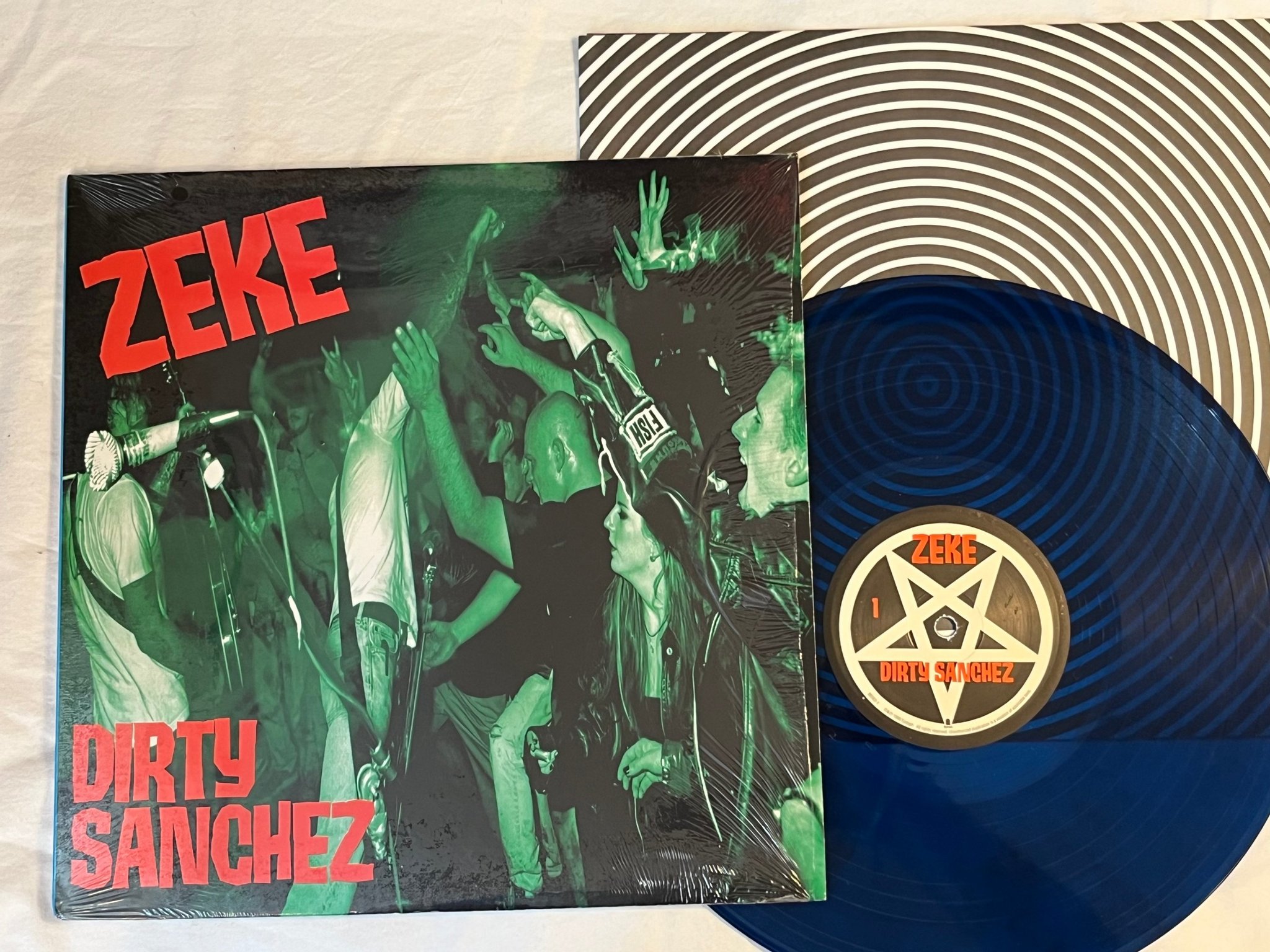 Omslagsbild för skivan ZEKE Dirty Sanchez LP 2000 US EPITAPH 86562-1 ** Blue transparent **