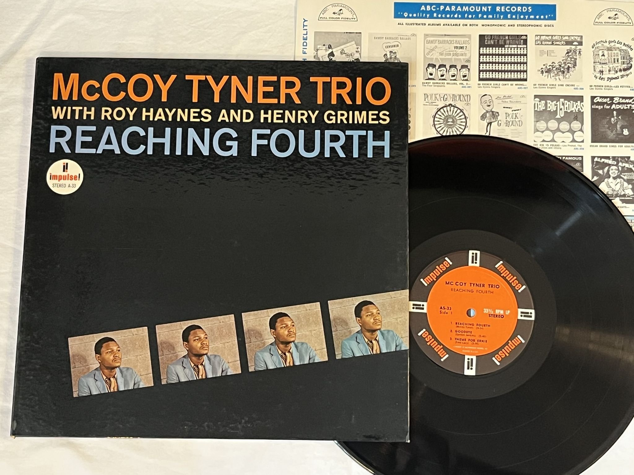 Omslagsbild för skivan McCOY TYNER TRIO reaching fourth LP -63 US IMPULSE AS-33