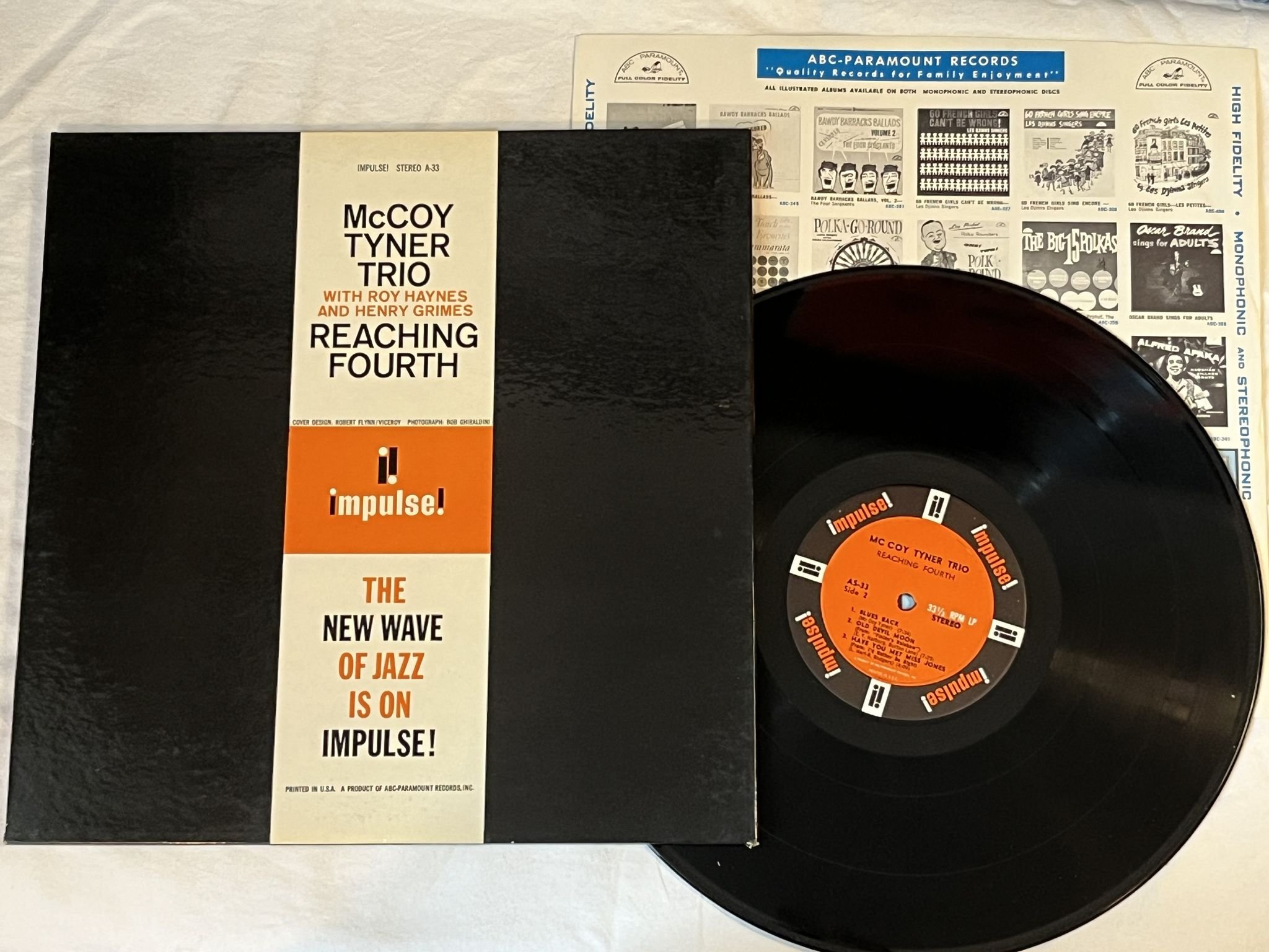 Omslagsbild för skivan McCOY TYNER TRIO reaching fourth LP -63 US IMPULSE AS-33