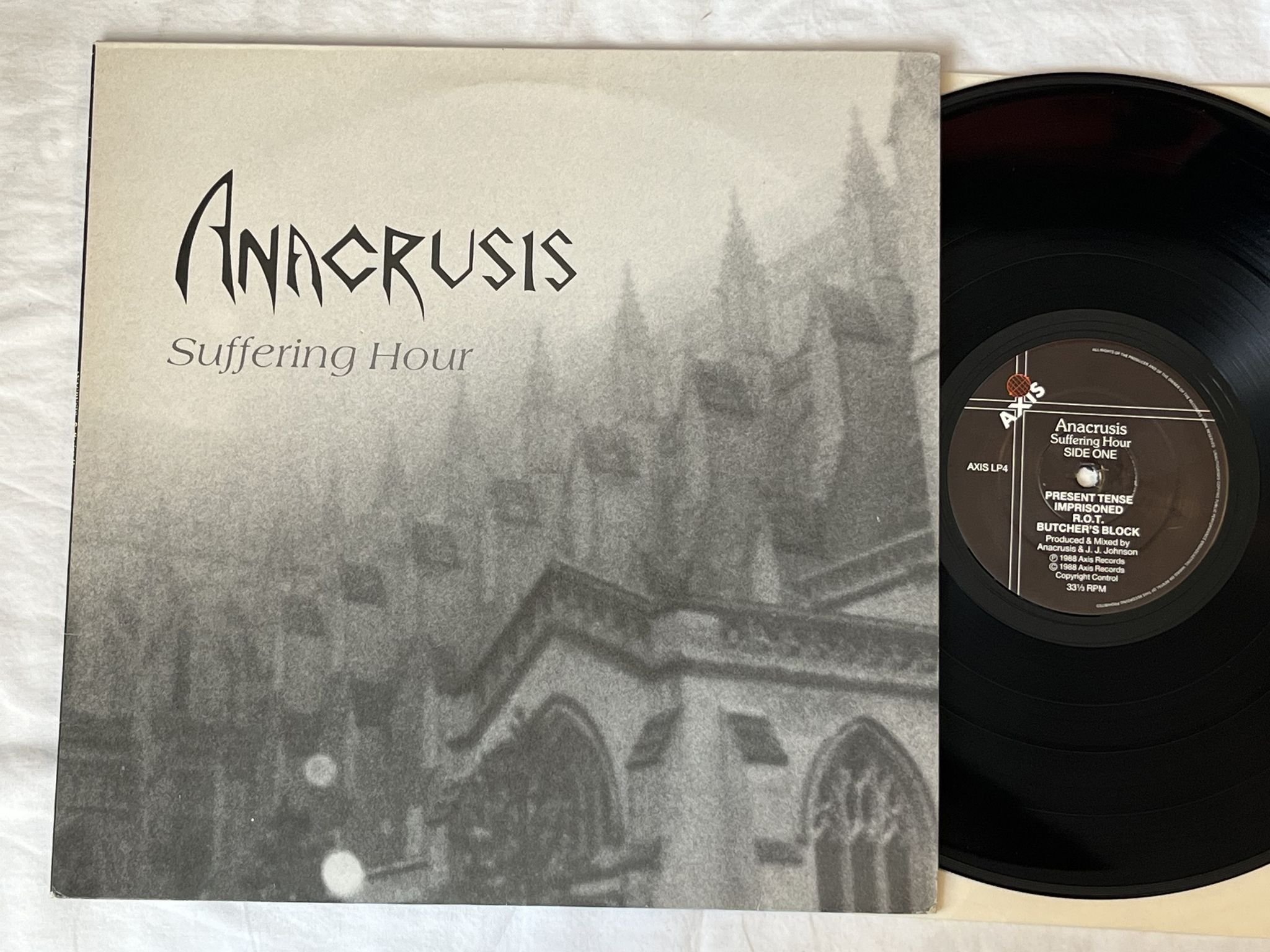 Omslagsbild för skivan ANACRUSIS Suffering Hour LP -88 axis lp4 *** TRASH ***