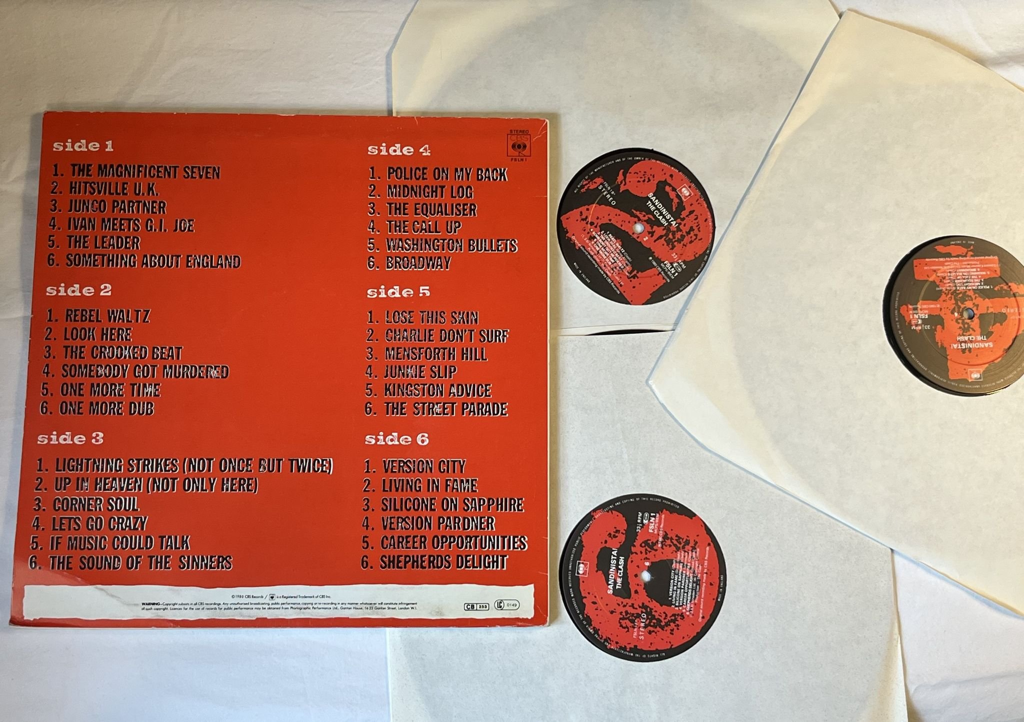 Omslagsbild för skivan THE CLASH sandinista! 3xLP -80 UK CBS FSLN 1