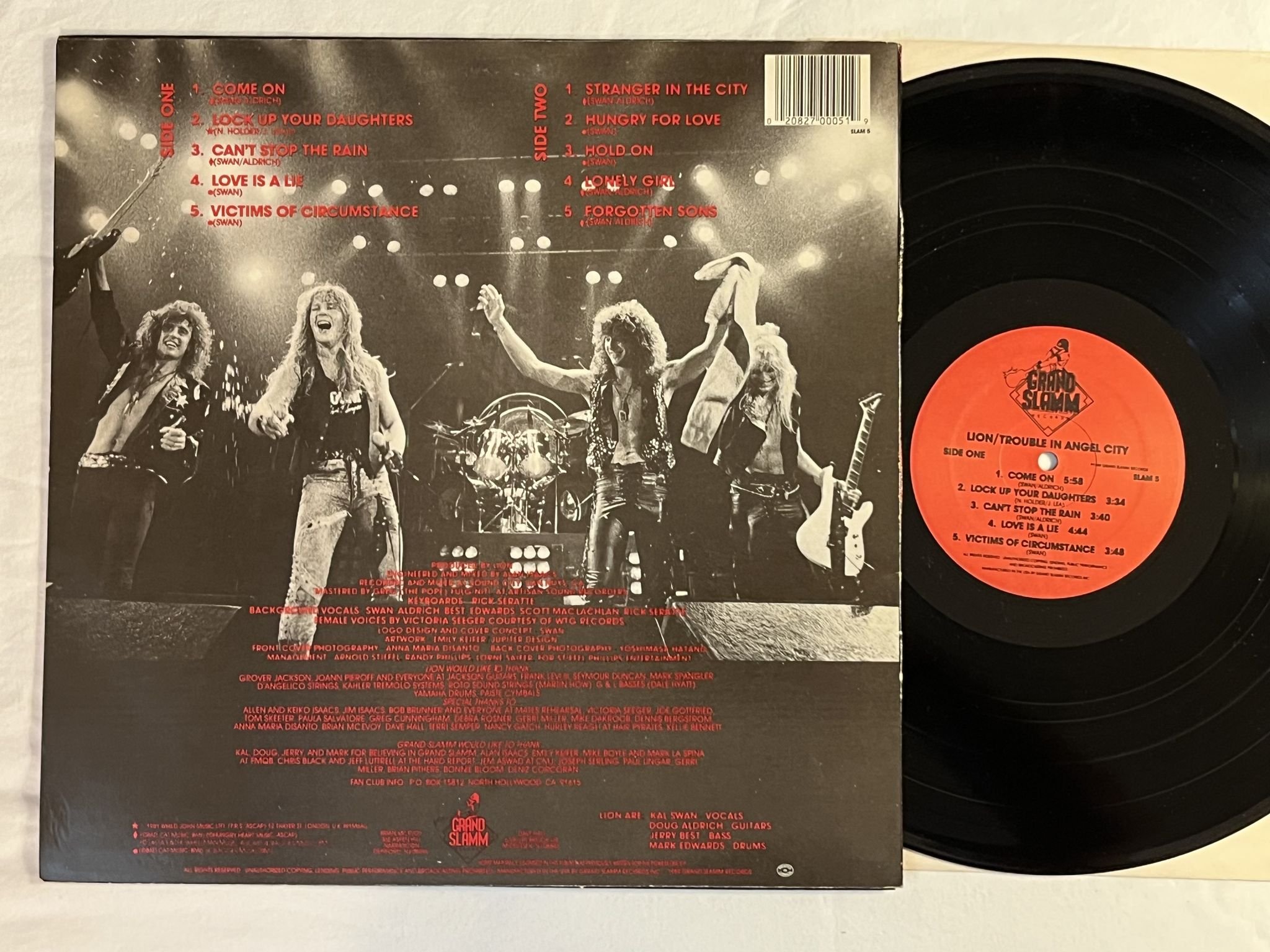 Omslagsbild för skivan LION trouble in angel city LP -89 US GRAND SLAMM SLAM 5