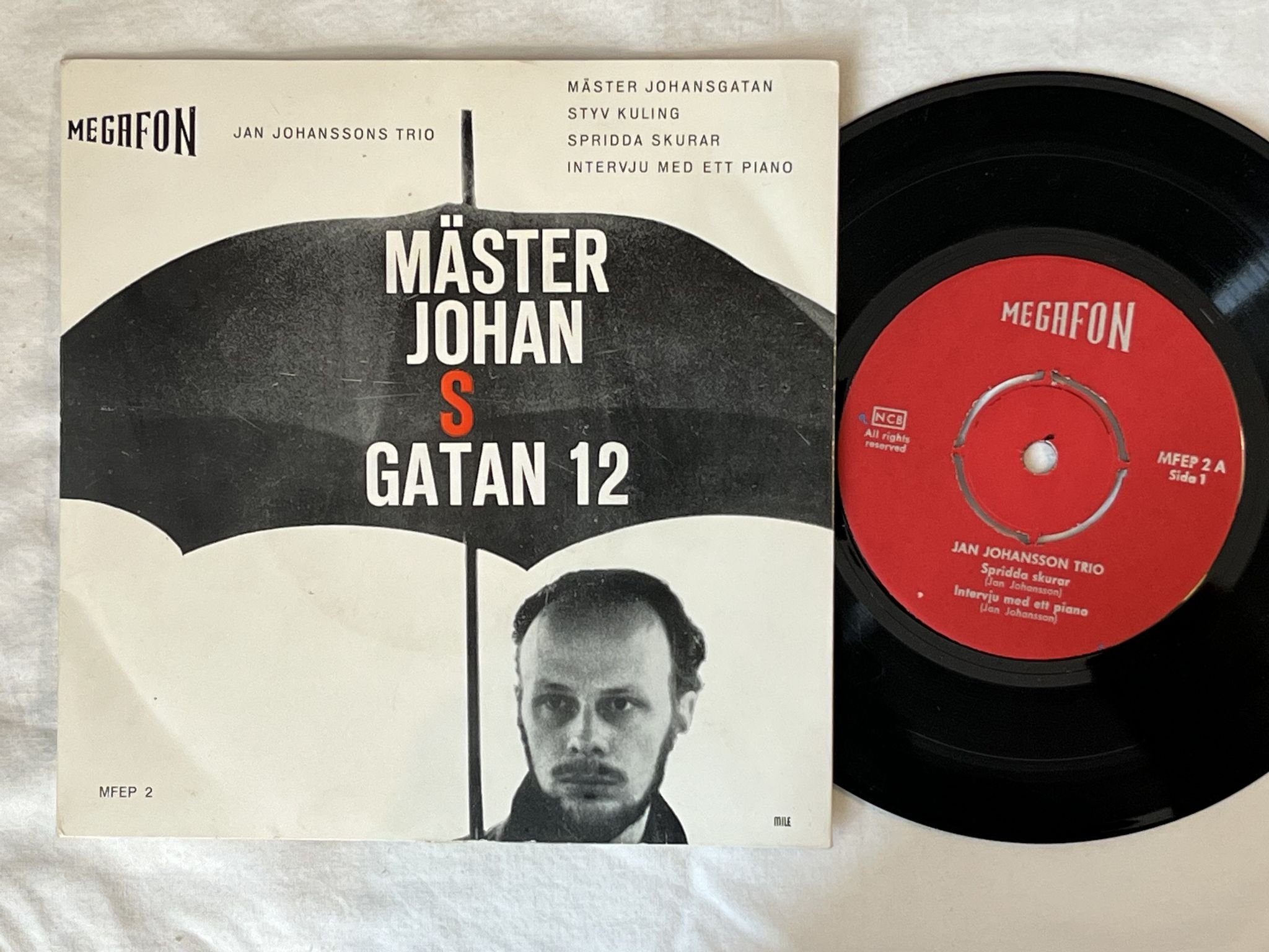 Omslagsbild för skivan JAN JOHANSSONS TRIO mäster johansgatan 12 "7"Single-60 SWE MFEP 2 MEGAFON