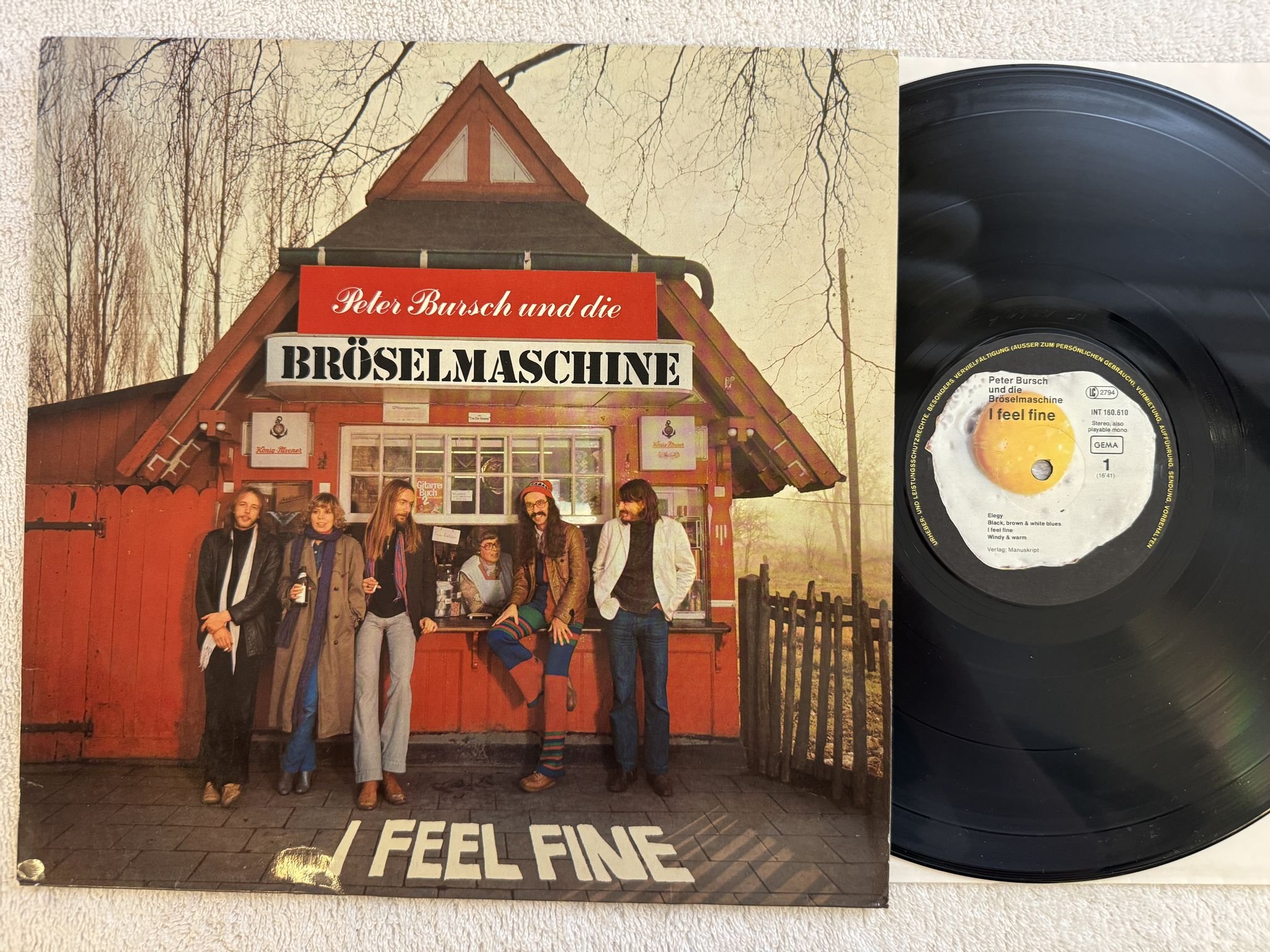 Omslagsbild för skivan PETER BURSCH UND DIE BRÖSELMASCHINE i feel fine LP -78 INT 160.610 Spiegelei