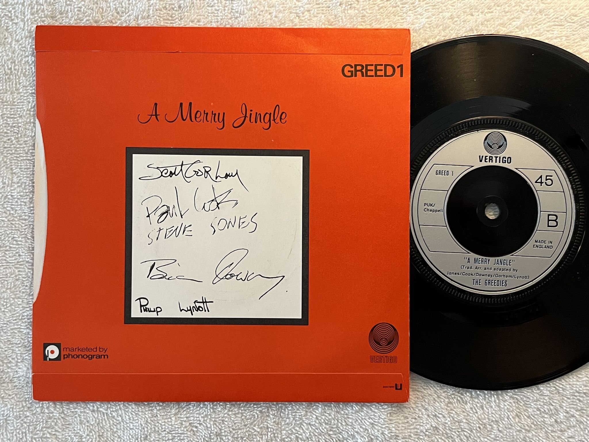 Omslagsbild för skivan THE GREEDIES a merry jingle 7" -79 UK VERTIGO GREED 1