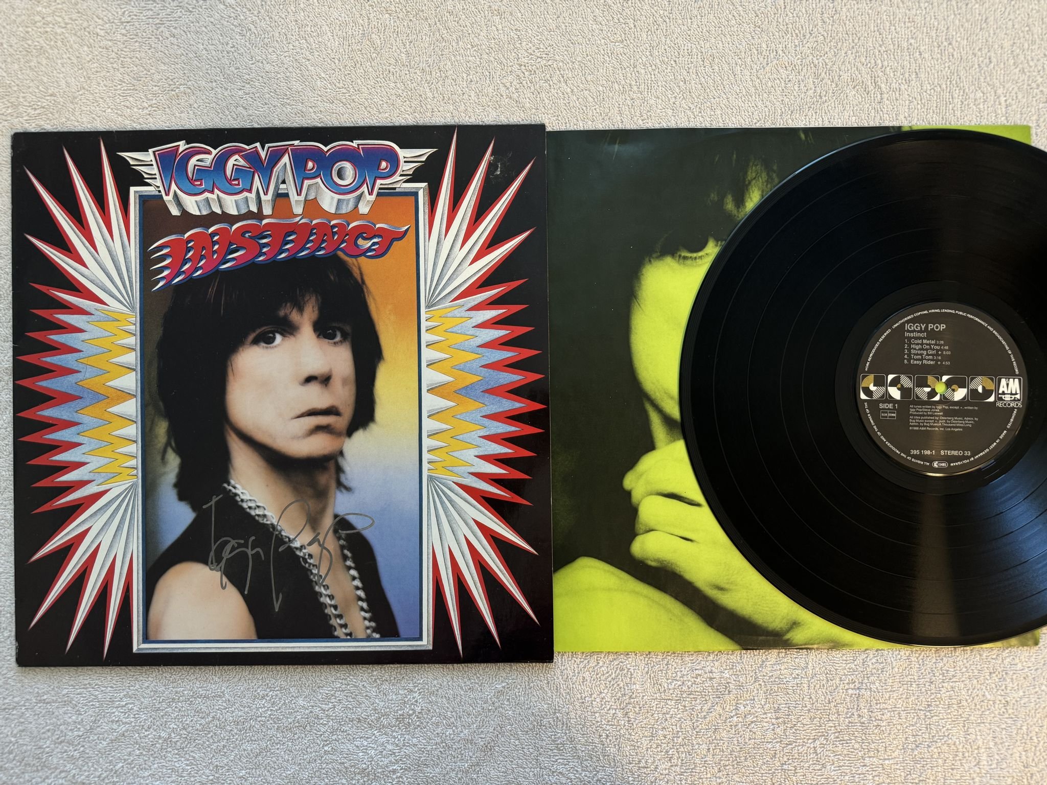 Omslagsbild för skivan IGGY POP instinct LP -88 A&M 395198-1 *** NICE SIGNATURE ON FRONT COVER ***