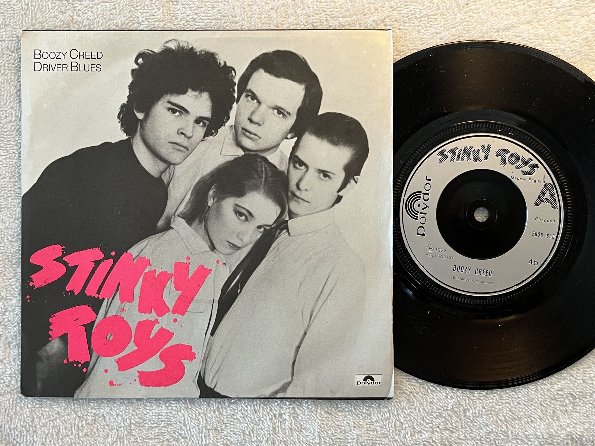 Omslagsbild för skivan STINKY TOYS Boozy Creed 7" -77 UK polydor 2056 630 *** PUNK 45 **