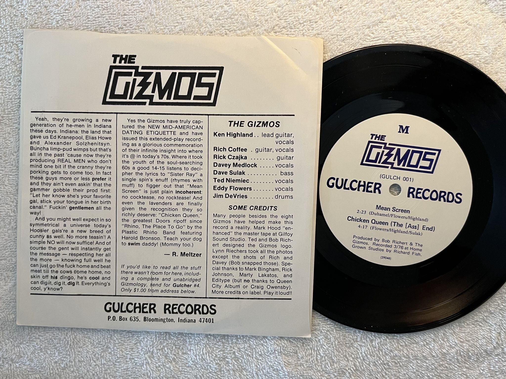 Omslagsbild för skivan THE GIZMOS Muff Divin' 7" -77 US GULCHER GULCH 001 ** PUNK ** blue text