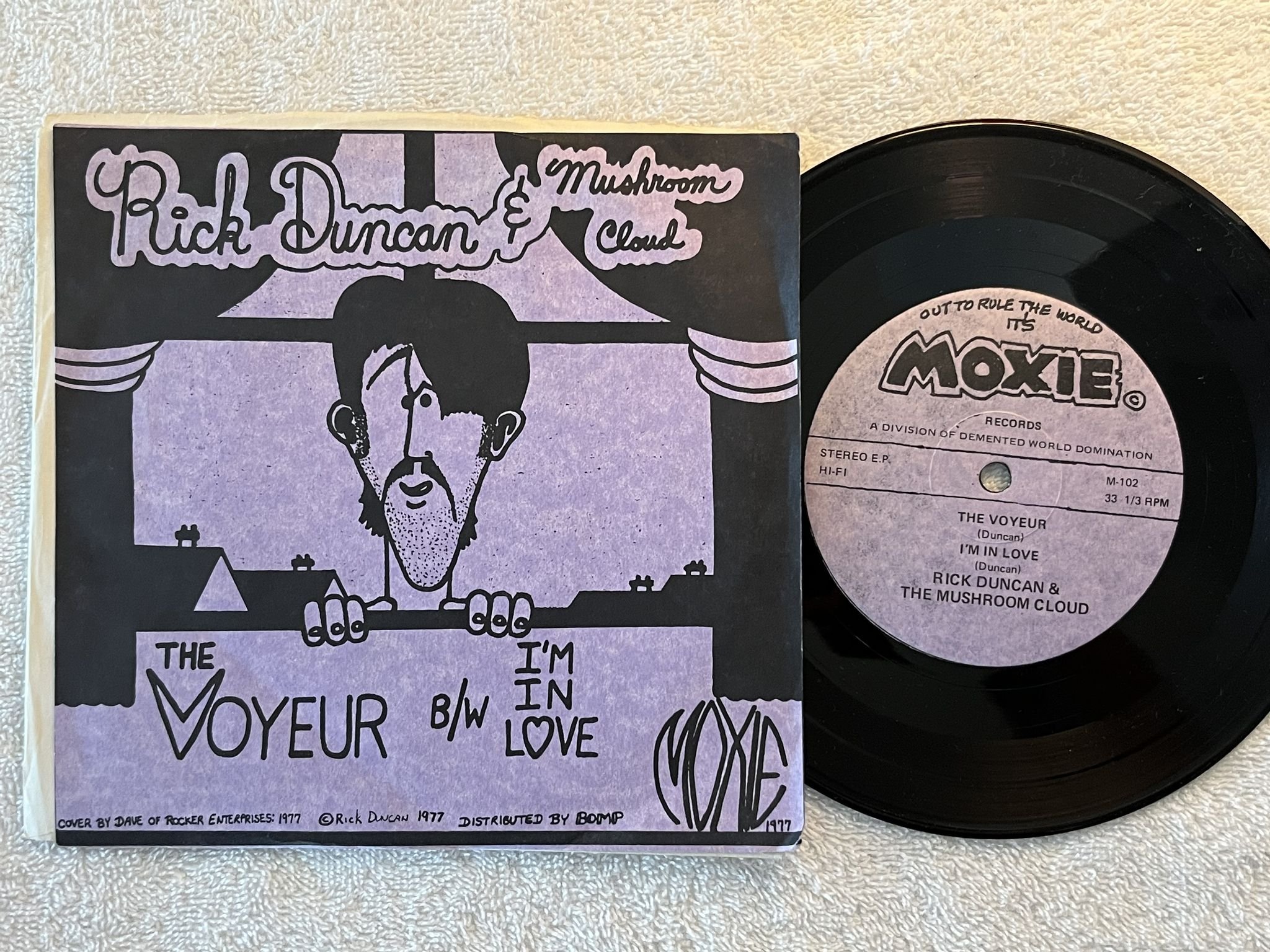 Omslagsbild för skivan RICK DUNCAN & MUSHROOM CLOUD The Voyeur 7" -77 US single sided MOXIE M-102