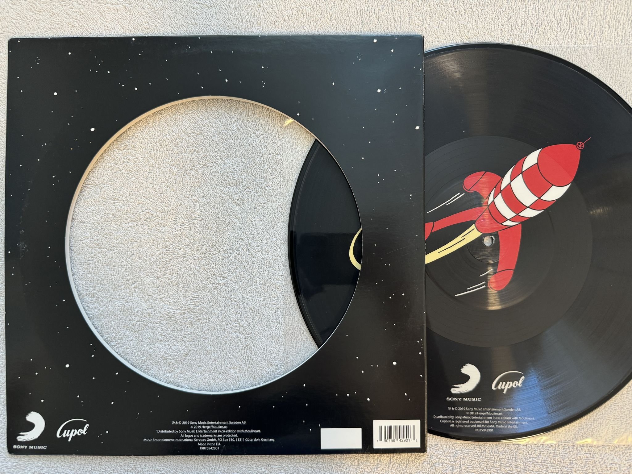 Omslagsbild för skivan Hergé – Tintin: Månen Tur Och Retur 12" PICTURE DISC Cupol – 190759429013