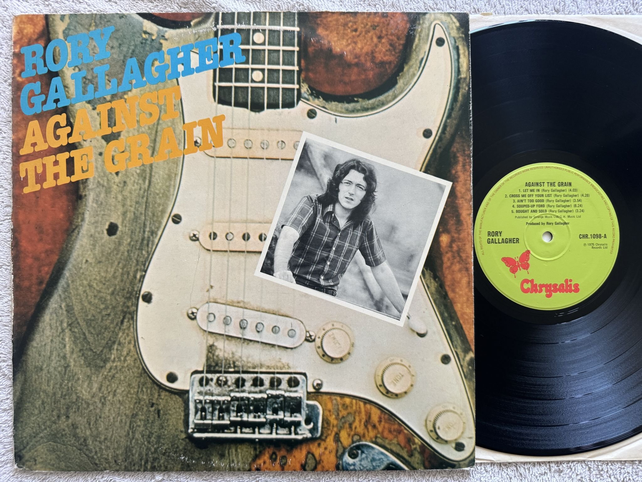 Omslagsbild för skivan RORY GALLAGHER against the grain LP -75 UK CHRYSALIS CHR 1098