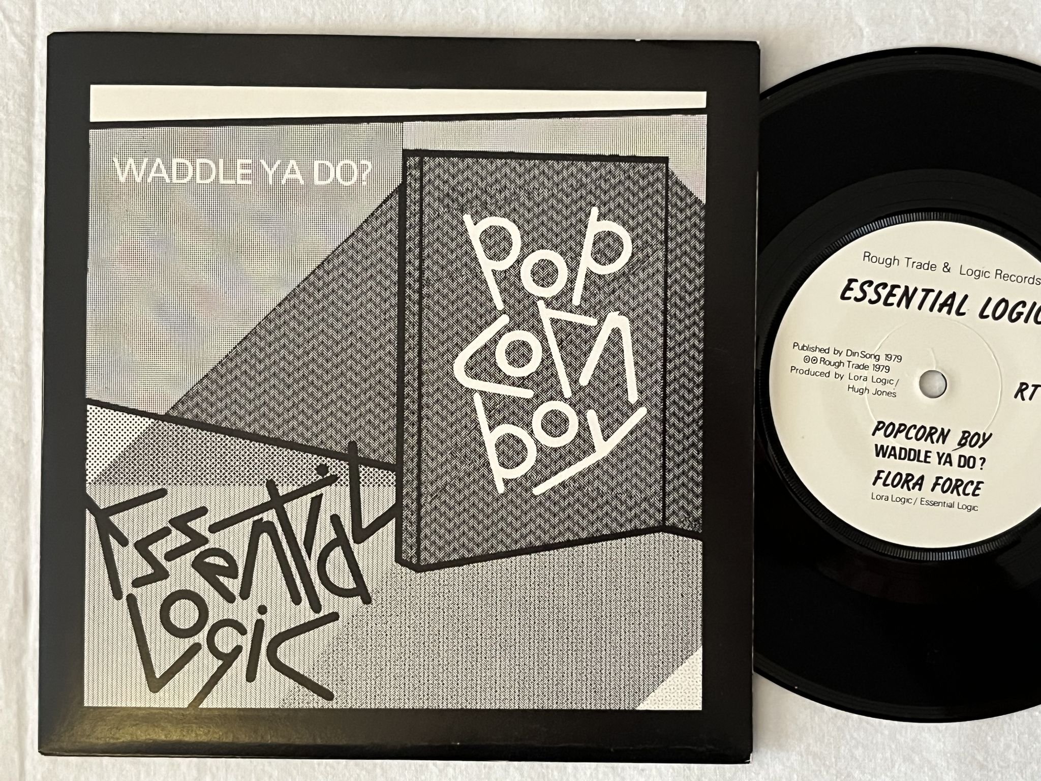 Omslagsbild för skivan ESSENTIAL LOGIC Popcorn Boy Waddle Ya Do? 7" -79 UK ROUGH TRADE RT 029
