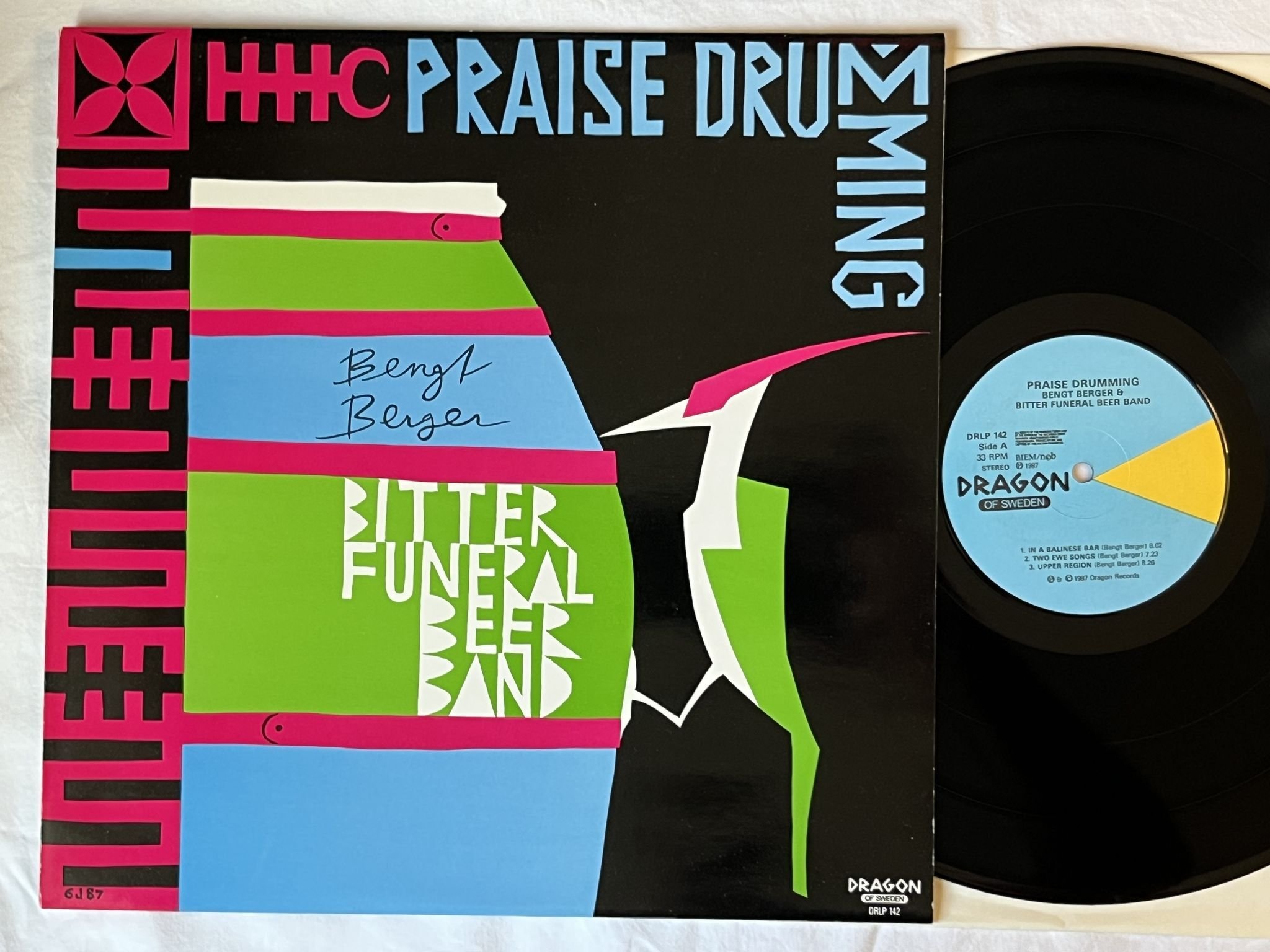 Omslagsbild för skivan Bengt Berger & Bitter Funeral Beer Band – Praise Drumming LP -87 DRLP 142