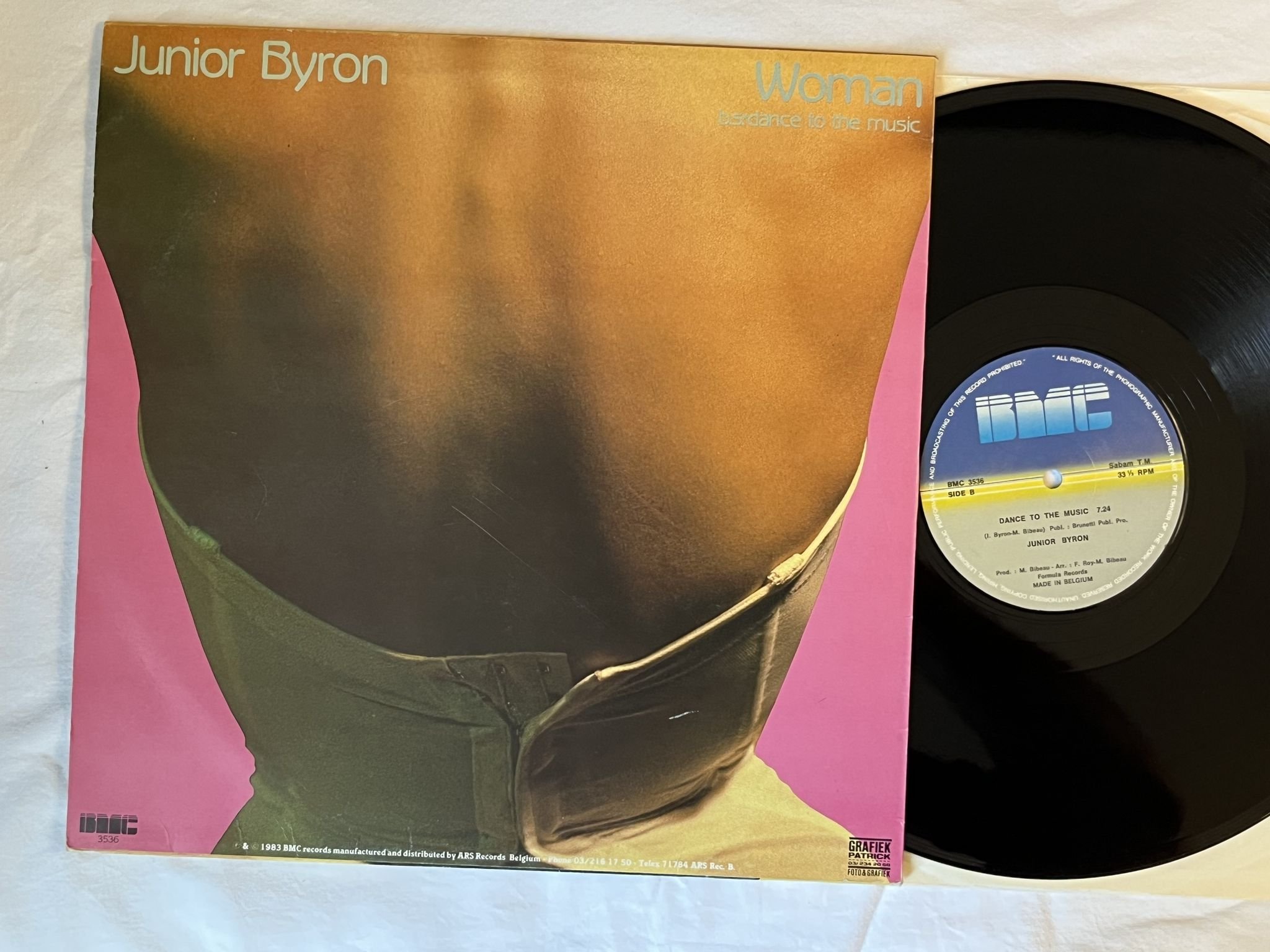 Omslagsbild för skivan JUNIOR BYRON Woman / Dance To The Music 12" -83 Belgium BMC 3536