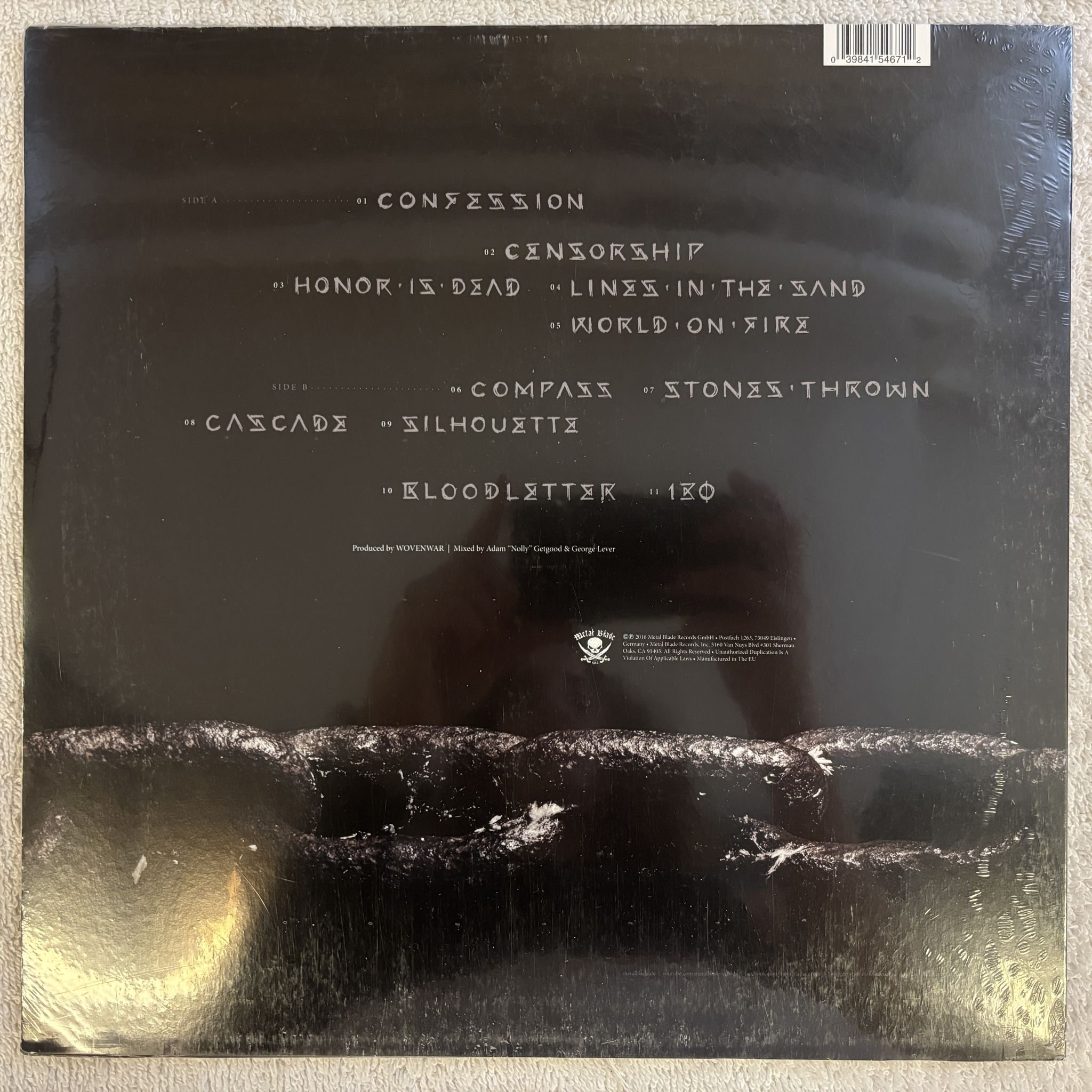 Omslagsbild för skivan WOVENWAR honor is dead