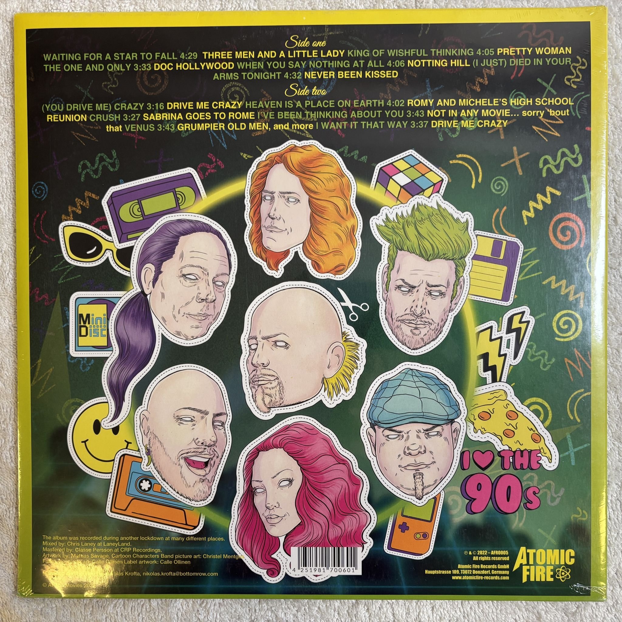 Omslagsbild för skivan AT THE MOVIES The Best Of 90's Movie Hits.. LP- 2022 Atomic Fire AFR0005