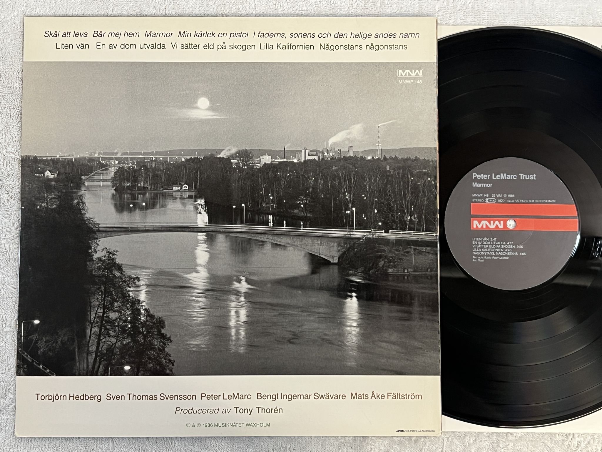 Omslagsbild för skivan PETER LEMARC TRUST Marmor LP -86 Swe MNW MNWP 148