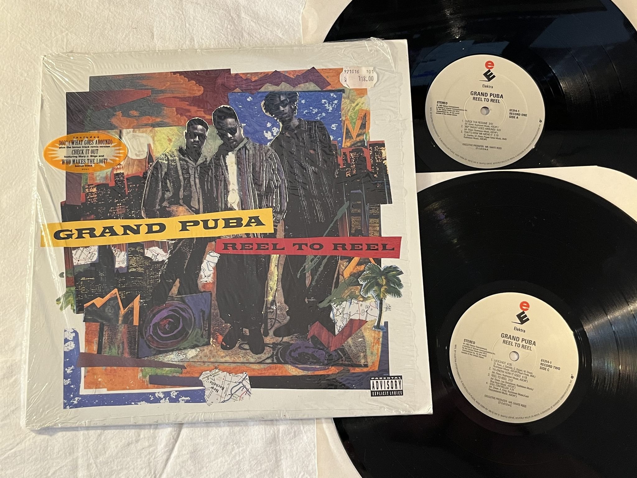 Omslagsbild för skivan GRAND PUBA Reel To Reel 2xLP -92 US ELEKTRA 61314-1 ** HYPE STICKER **