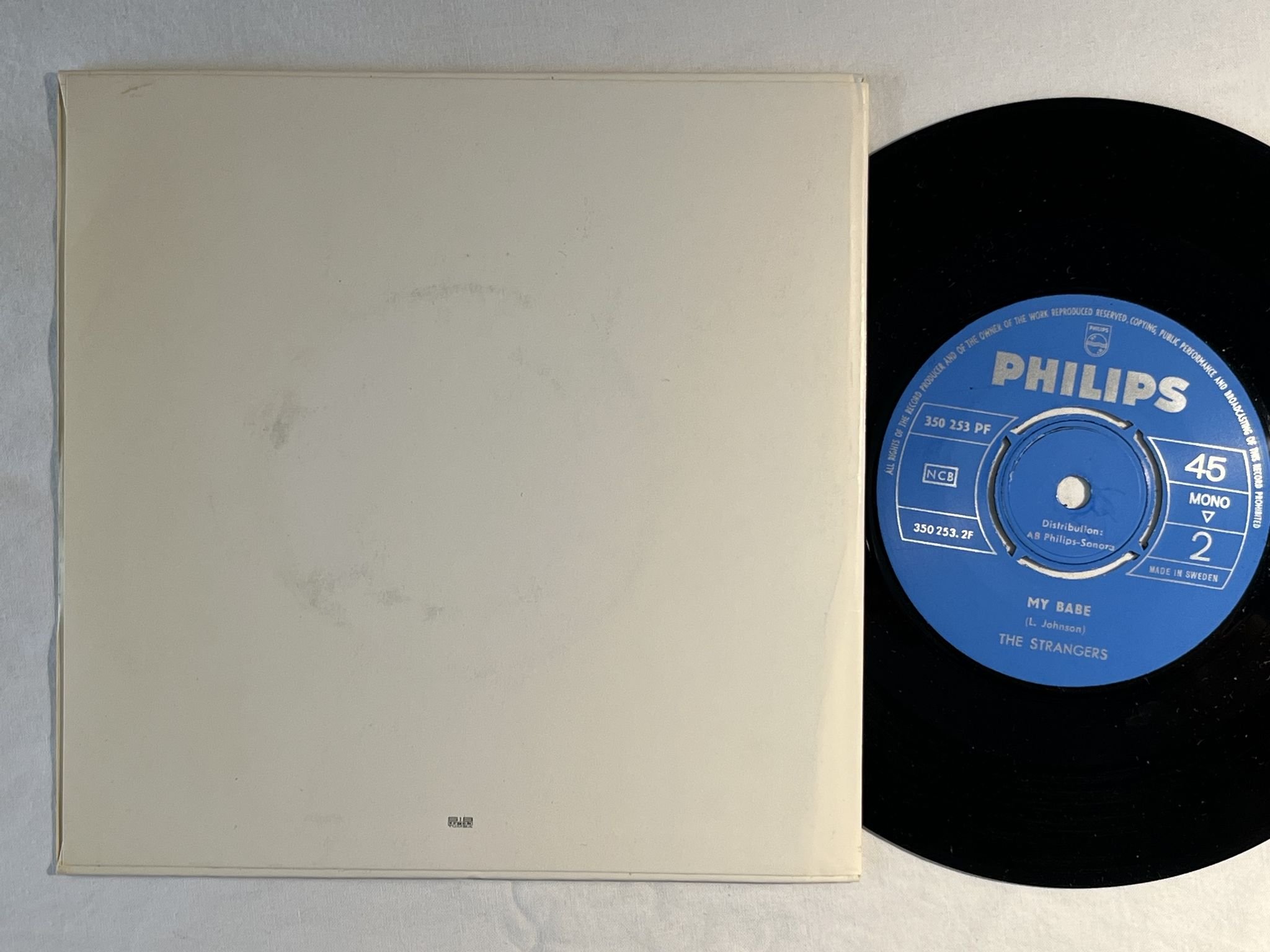 Omslagsbild för skivan THE STRANGERS Who Wouldn't Love A Girl Like That 7" -64 PHILIPS 350 253 PF