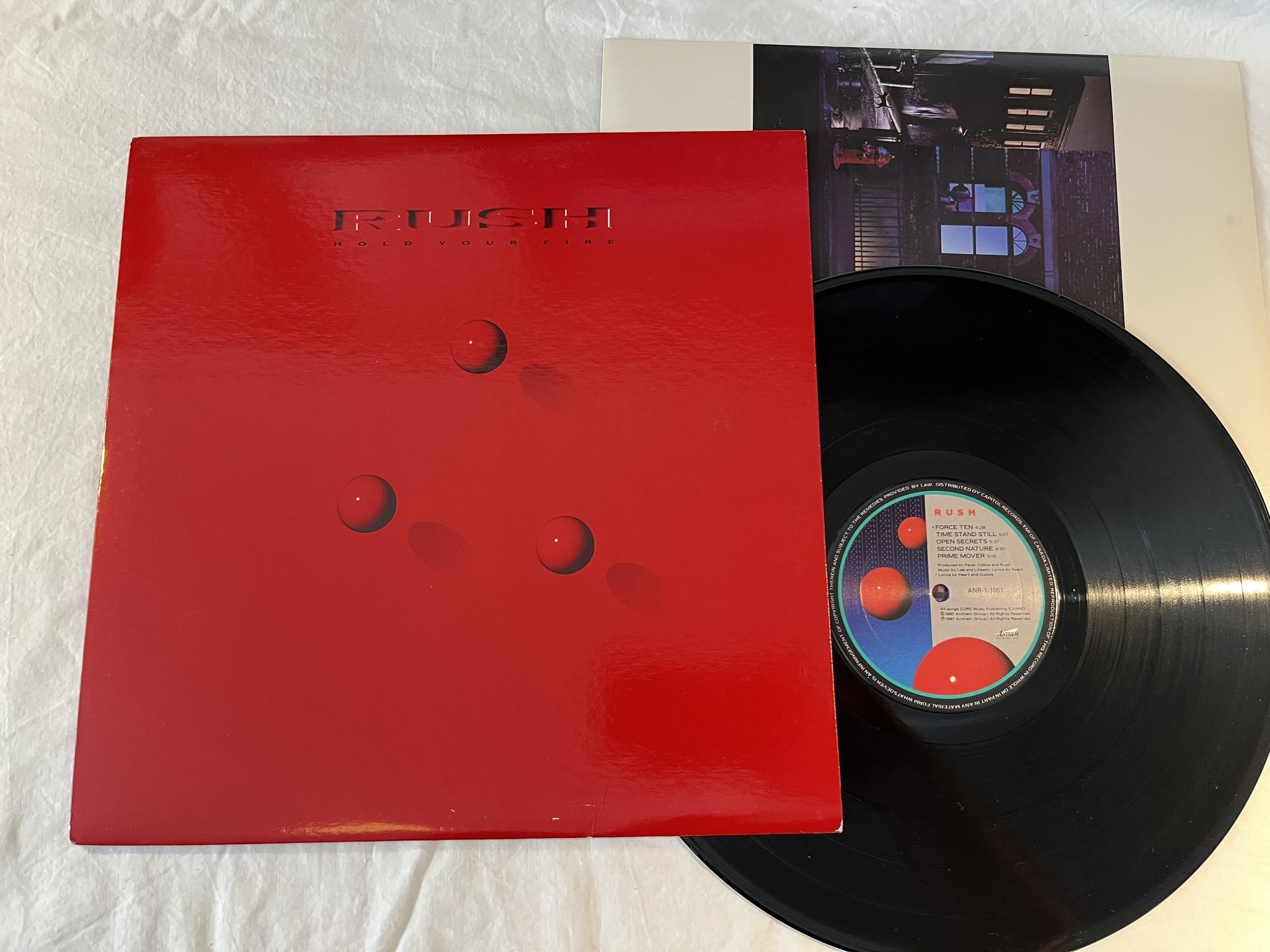 Omslagsbild för skivan RUSH hold your fire LP -87 Can ANTHEM ANR-1-1051