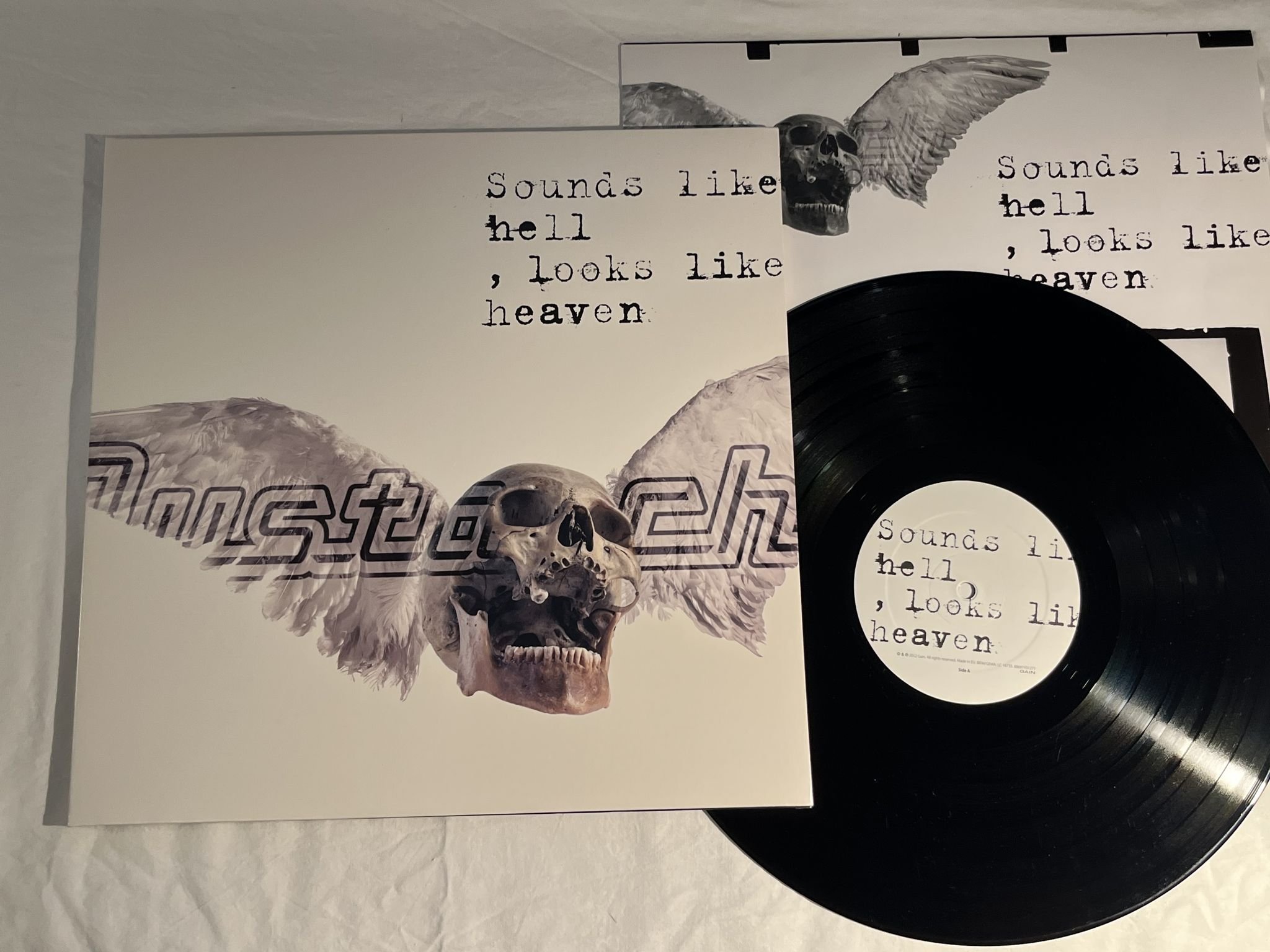 Omslagsbild för skivan MUSTASCH Sounds Like Hell, Looks Like Heaven LP 2012 GAIN 88691931271