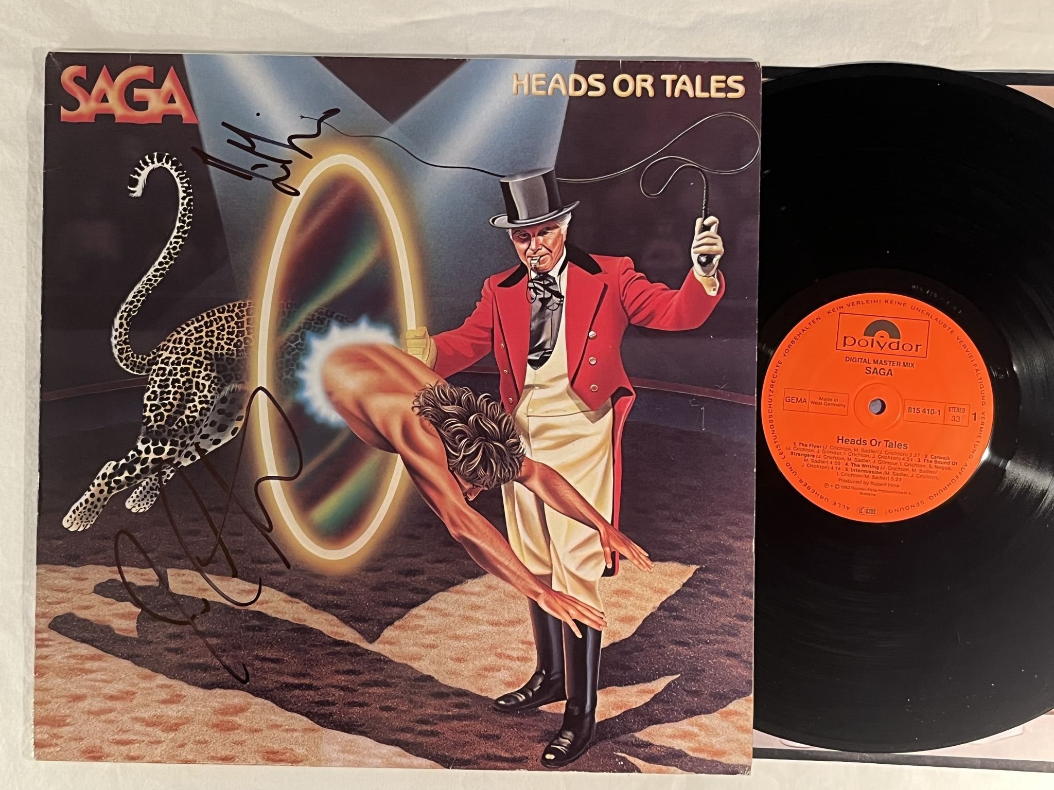 Omslagsbild för skivan SAGA heads or tales LP -83 Ger POLYDOR 815410-1 ** SIGNED BY 2 BAND MEMEBERS **
