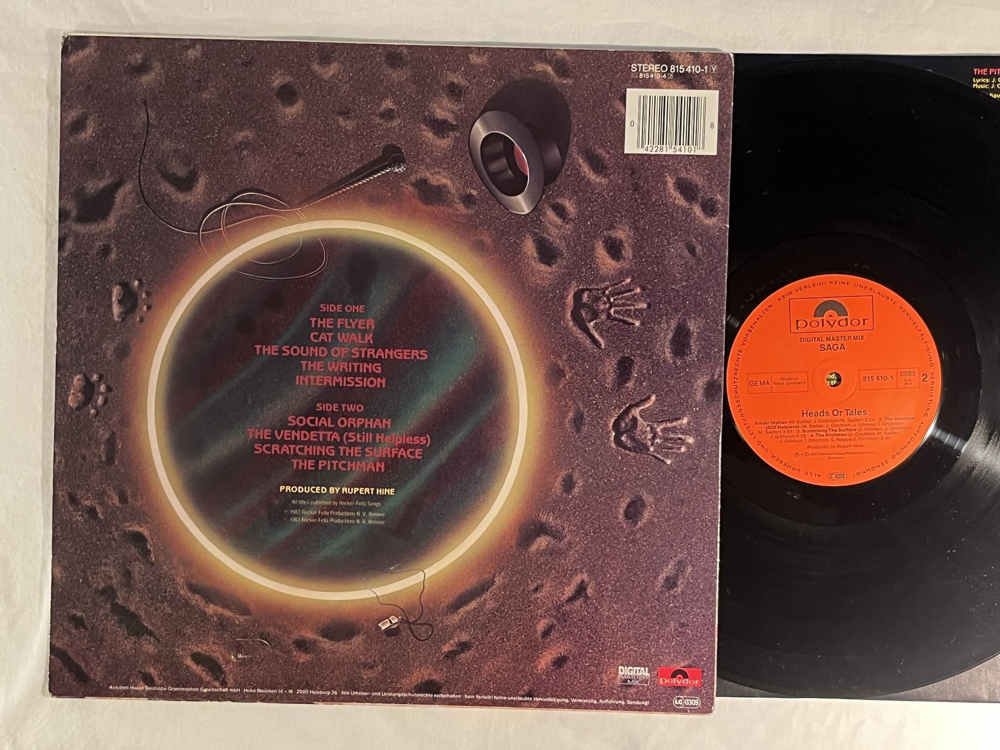 Omslagsbild för skivan SAGA heads or tales LP -83 Ger POLYDOR 815410-1 ** SIGNED BY 2 BAND MEMEBERS **