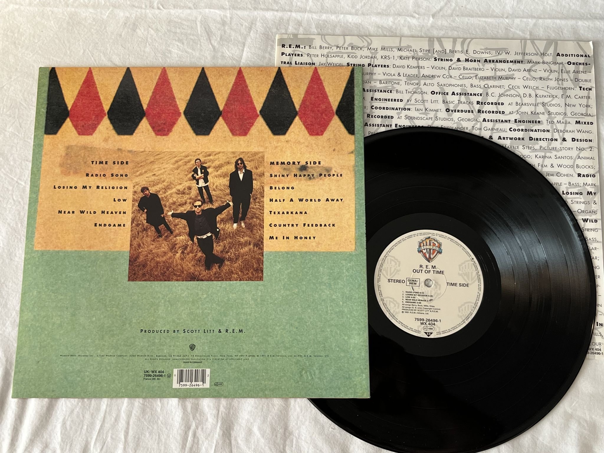Omslagsbild för skivan R.E.M. out of time LP -91 WARNER BROS 7599-26496-1