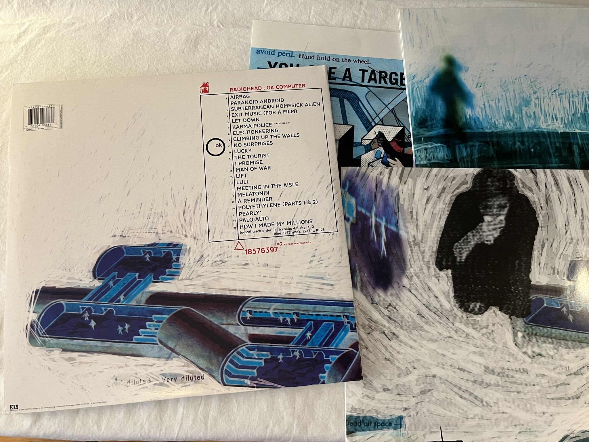 Omslagsbild för skivan RADIOHEAD OK Computer OKNOTOK 1997 2017 3xLP 2017 XL RECORDINGS ** BLUE VINYL **